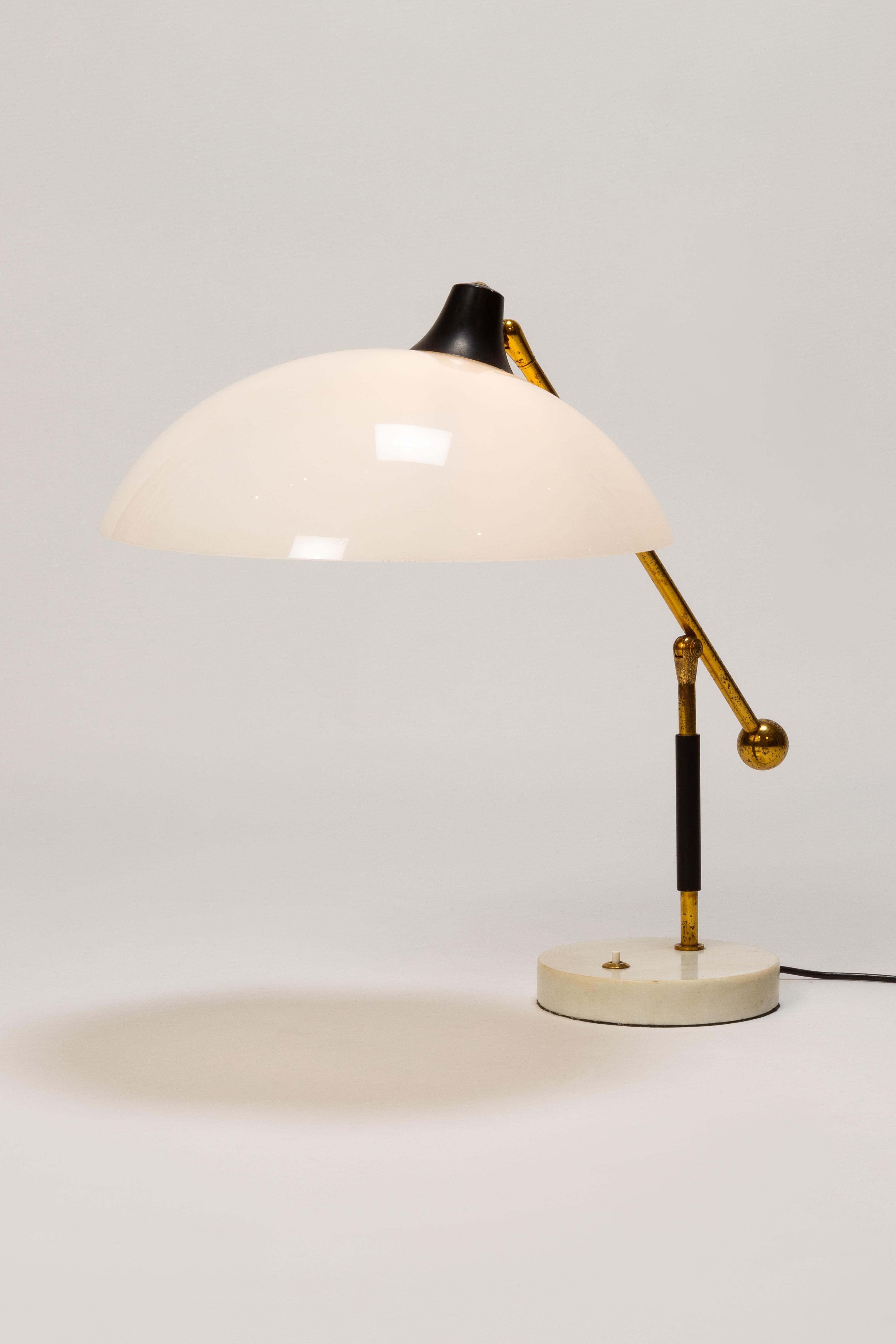 Table lamp manufactured by Stilux in the 1950s in Italy, Milan. Fine table lamp with a solid white marble base. Acrylic glass shade attached to a brass joint.