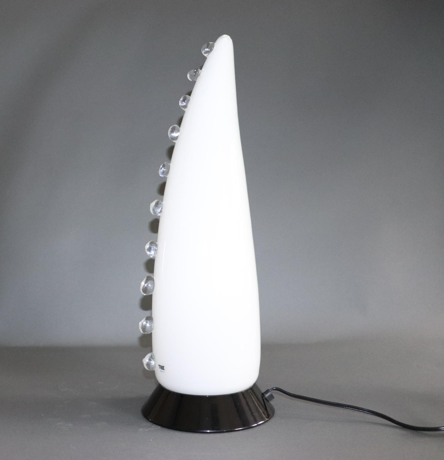 Italian table lamp in white Murano hand blown glass with crystal details.
The 