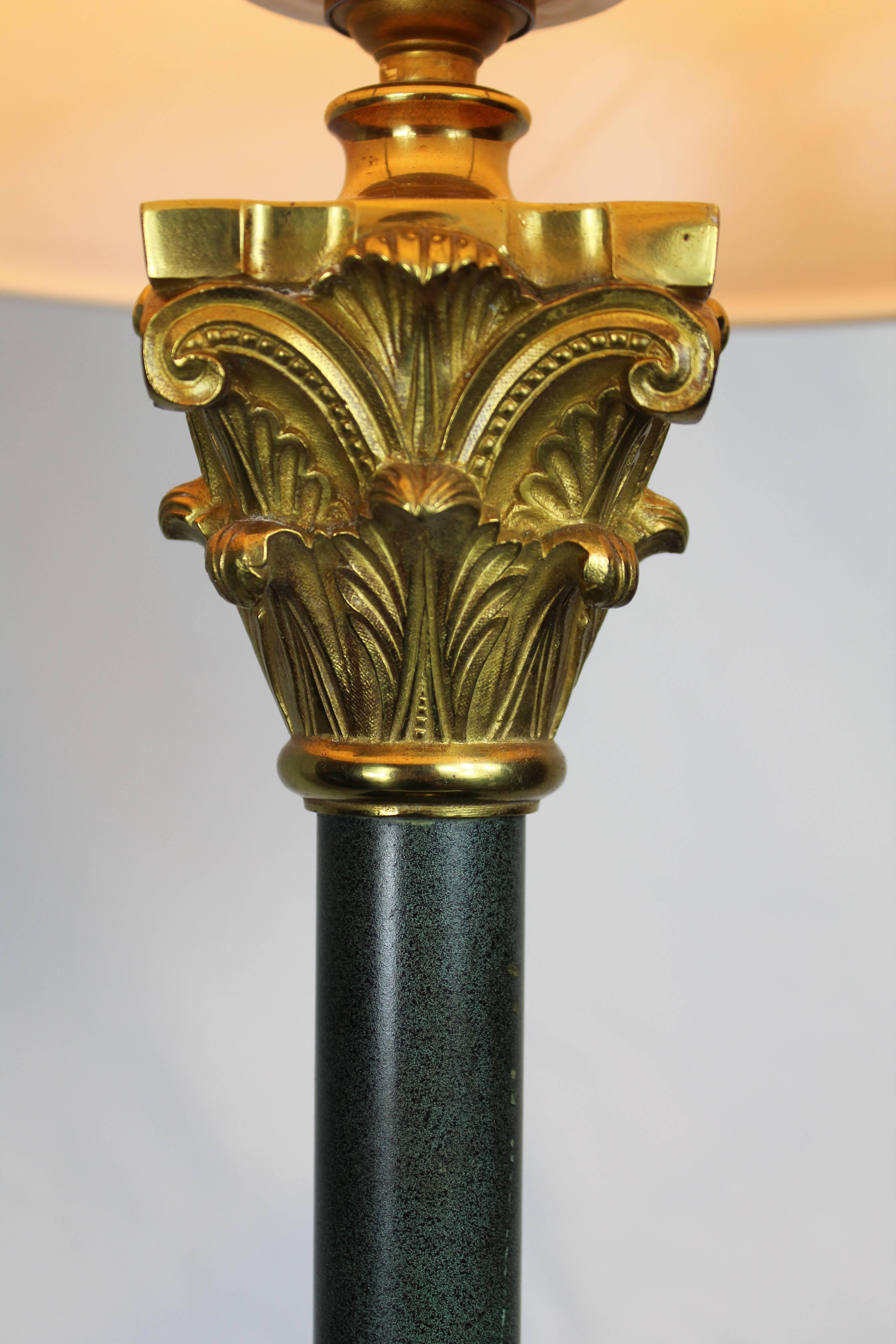 This table lamp with a column stem features a marble base and brass finishes. Made in Italy, circa 1950.