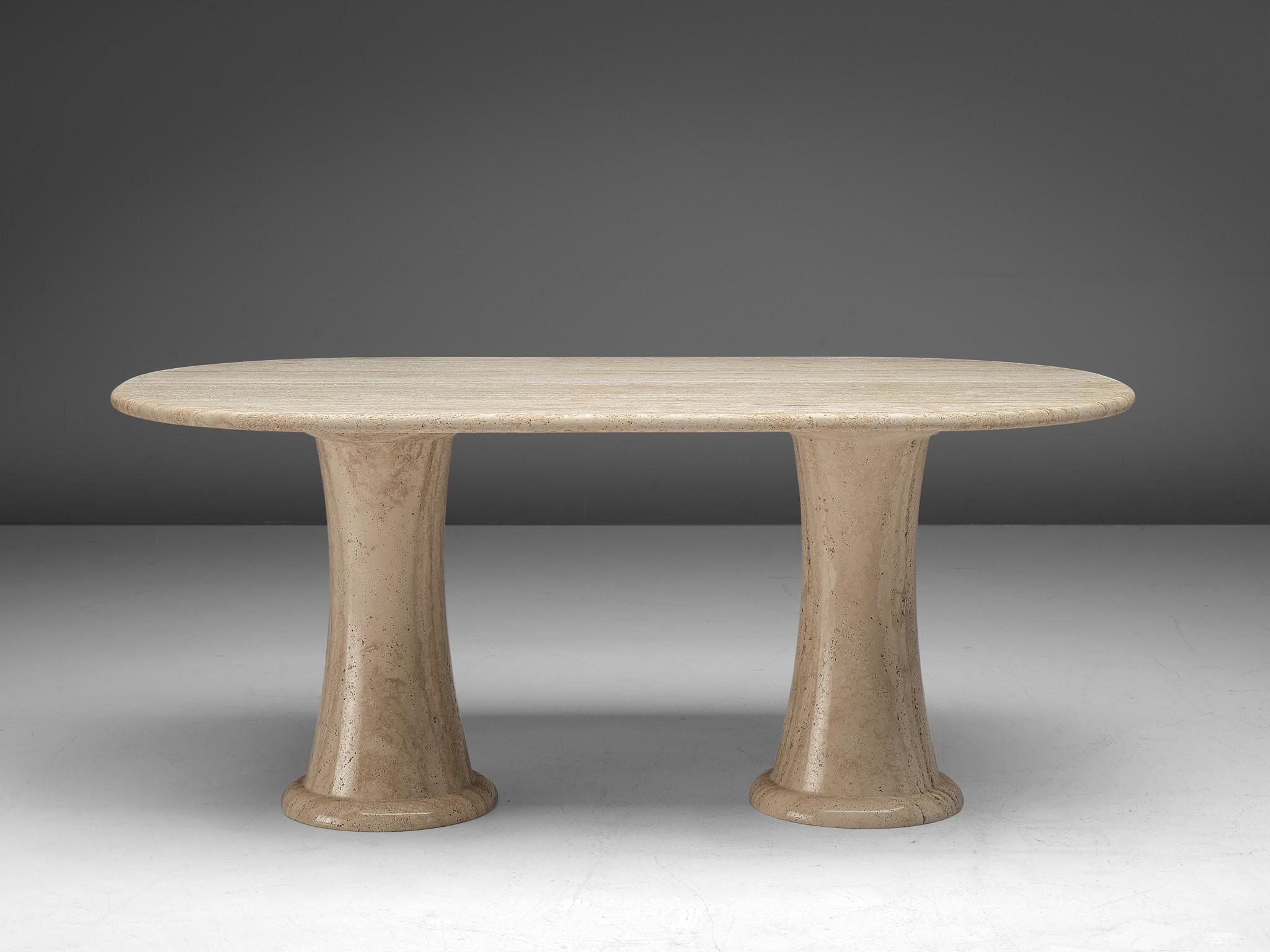 Dining table, travertine, Italy, 1970s.

This sculptural center table is a typical example of postmodern design. The dining table is executed in travertine by means of which a warm, natural yet monumental look is created. The thick, oval top rests