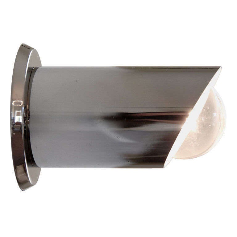 These sleek high polished chrome and aluminum tailpipe sconces provide a sharp accent light. Very popular in the 70s Italy, these small sconces lend a modern and clean detail to any room. 2 available. 
Diameter: 2.25