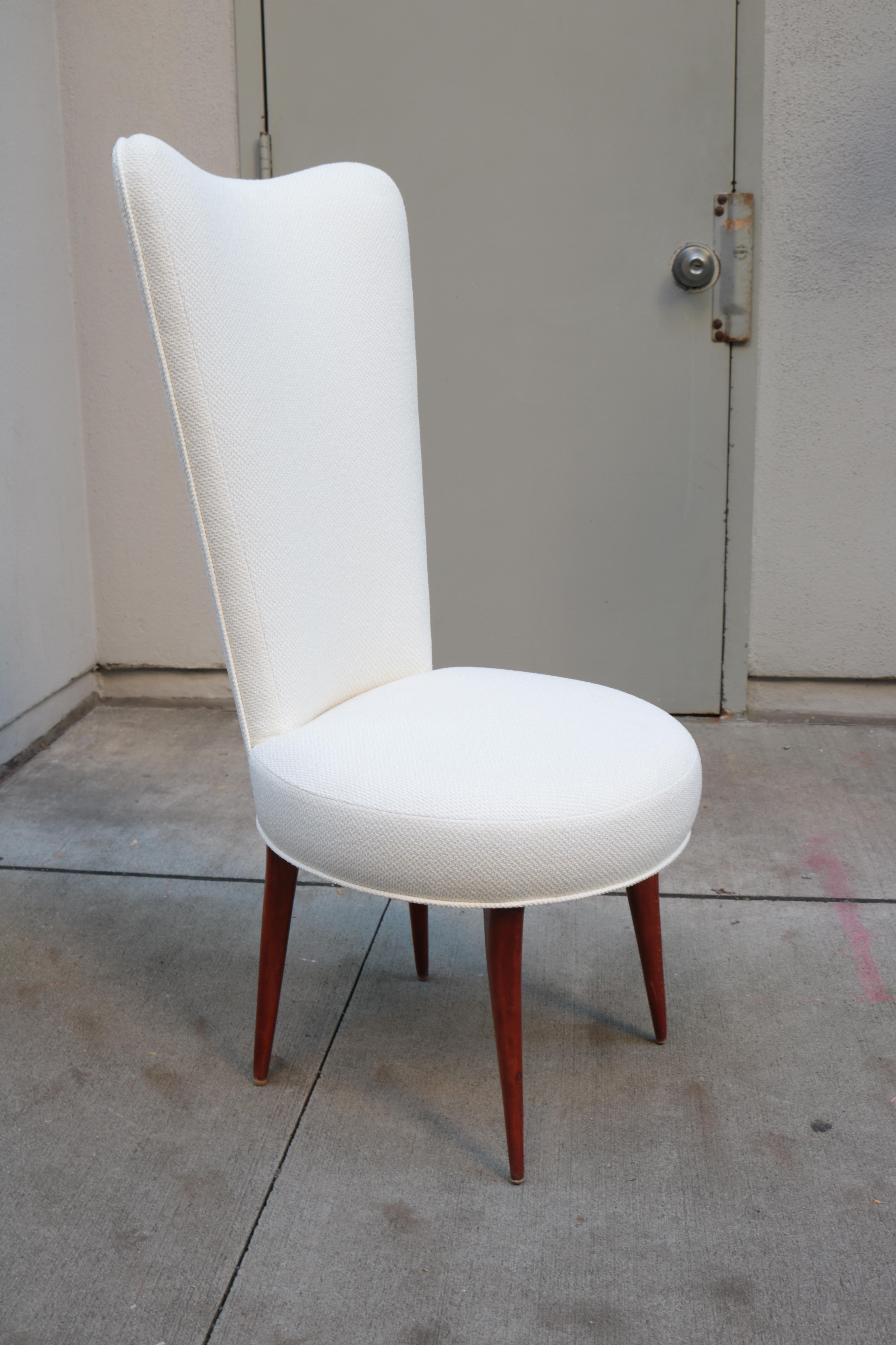 An Italian tall back side chair. 
Upholstered with beechwood legs.