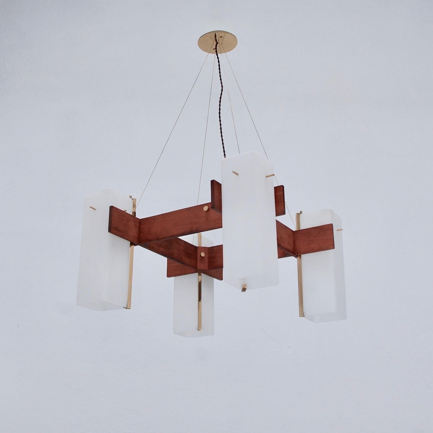 1950s Mid-Century Modern Italian teak Cubic chandelier with 4 hand blown cubic satin opal glass shades. Partially restored, patinated brass finish. 4 E26 medium based sockets. Light bulbs included with order. 
Measurements:
Drop: 36”
Fixture