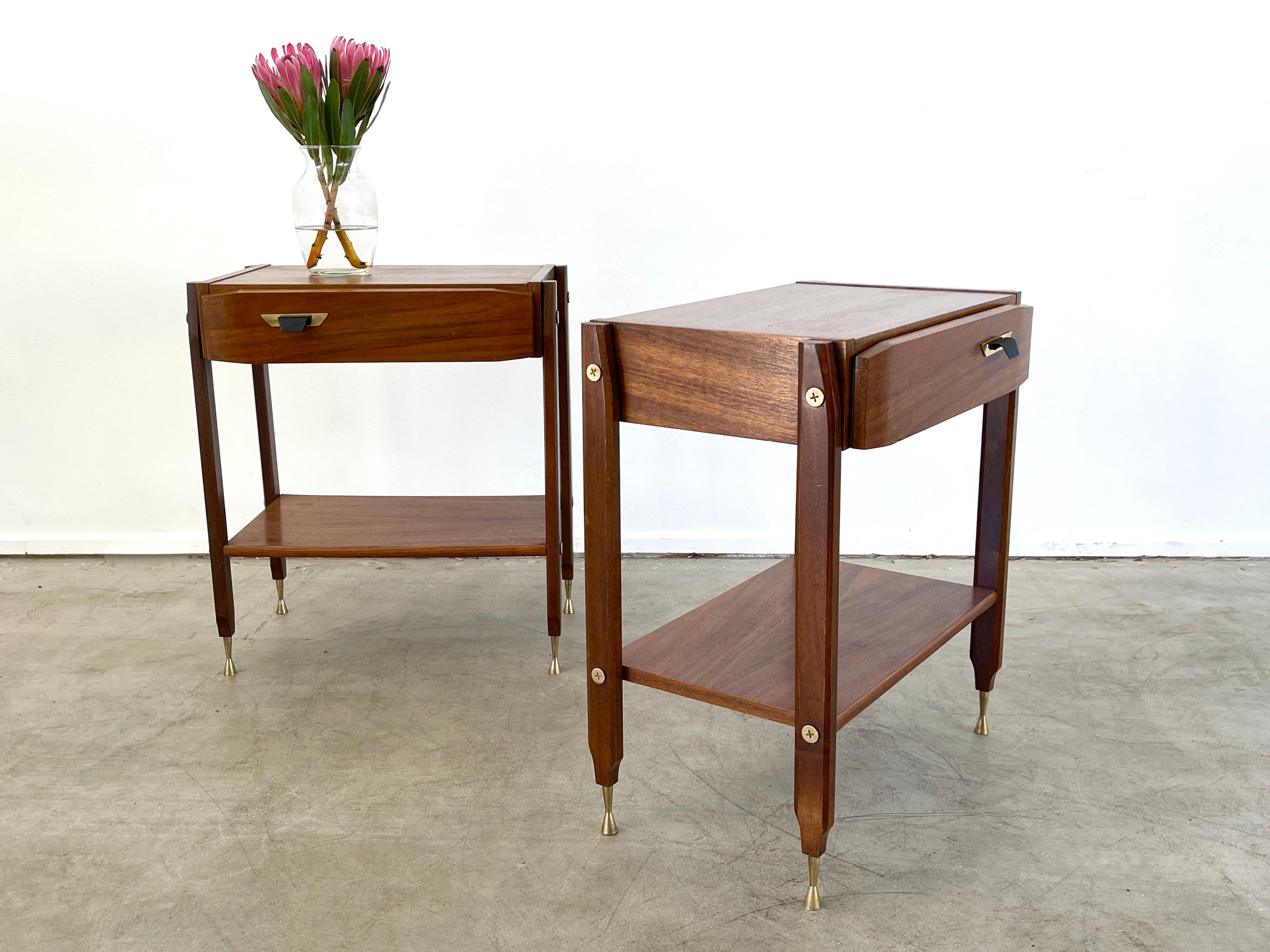 Fantastic pair of unique Italian nightstands constructed of teak, mahogany with brass hardware.
Great angular shaped drawer with tapered legs and solid brass feet.
Contrasting wood on legs 
Great design!