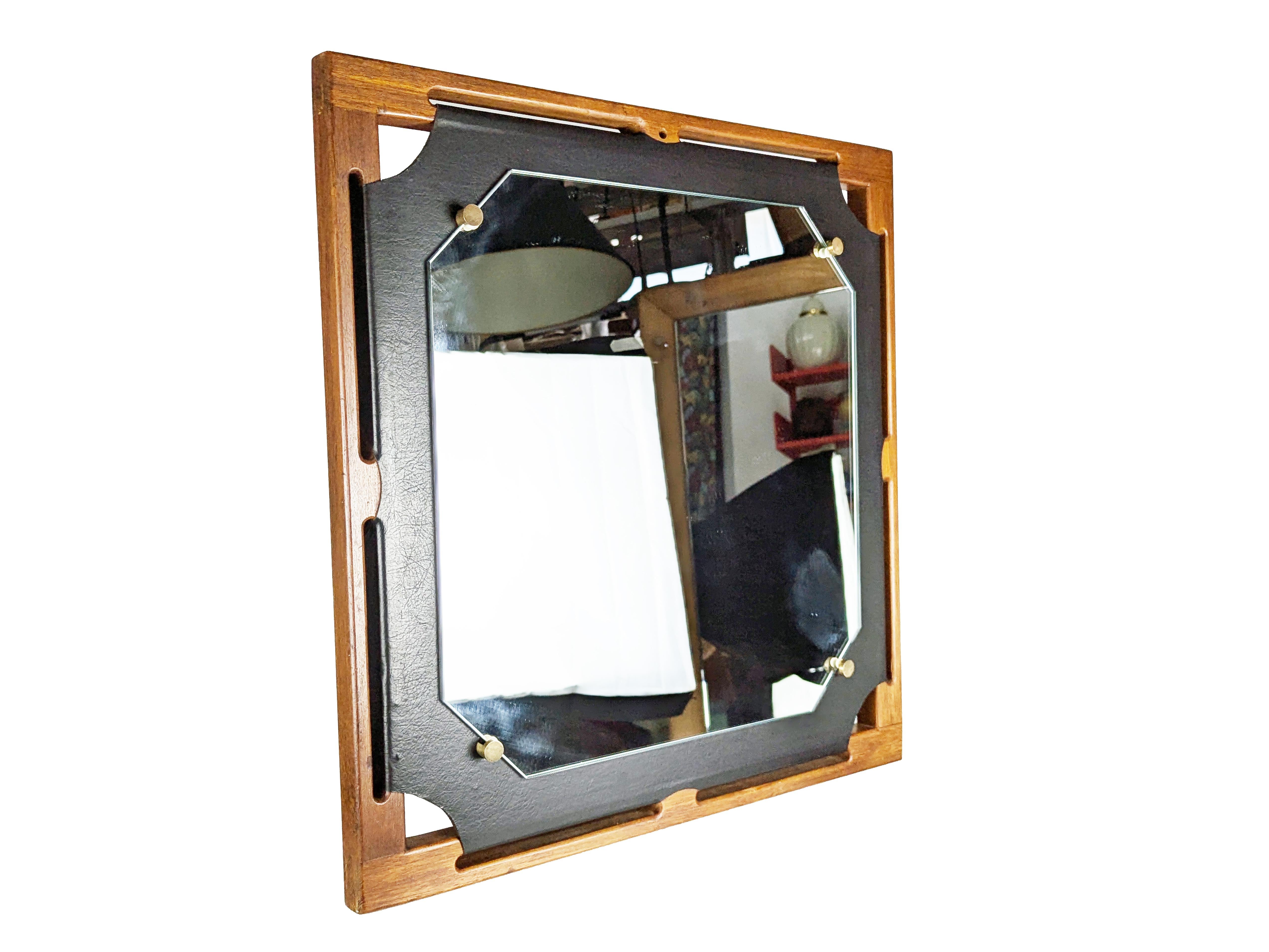 Mid-Century Modern Italian teakwood & black skai 1960s wall mirror For Sale