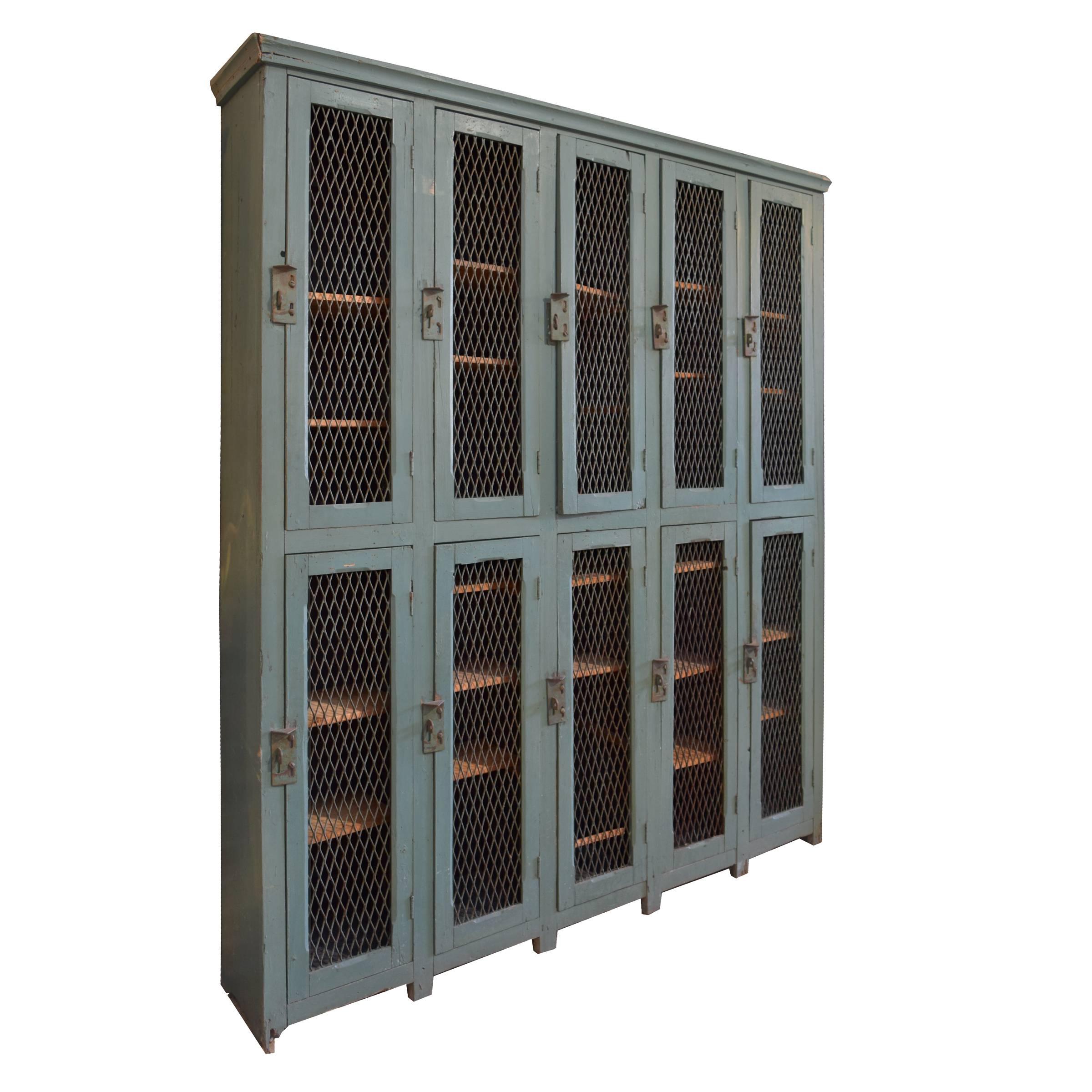A fantastic Italian locker with ten doors, interior shelves, and a great green color, circa 1940. Pair available.