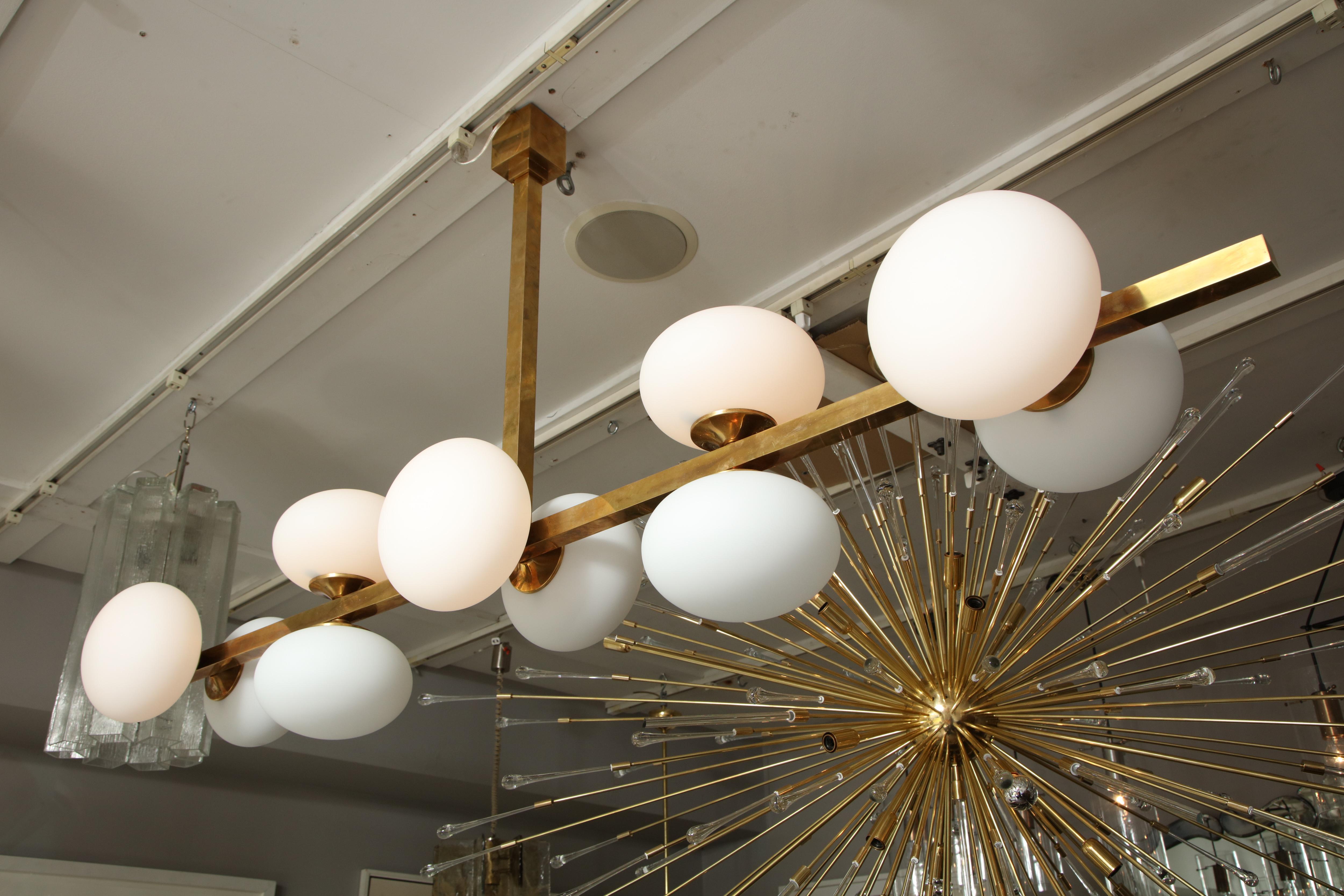 Mid-Century Modern Ten Elongated Opaline Glass Globe Chandelier For Sale