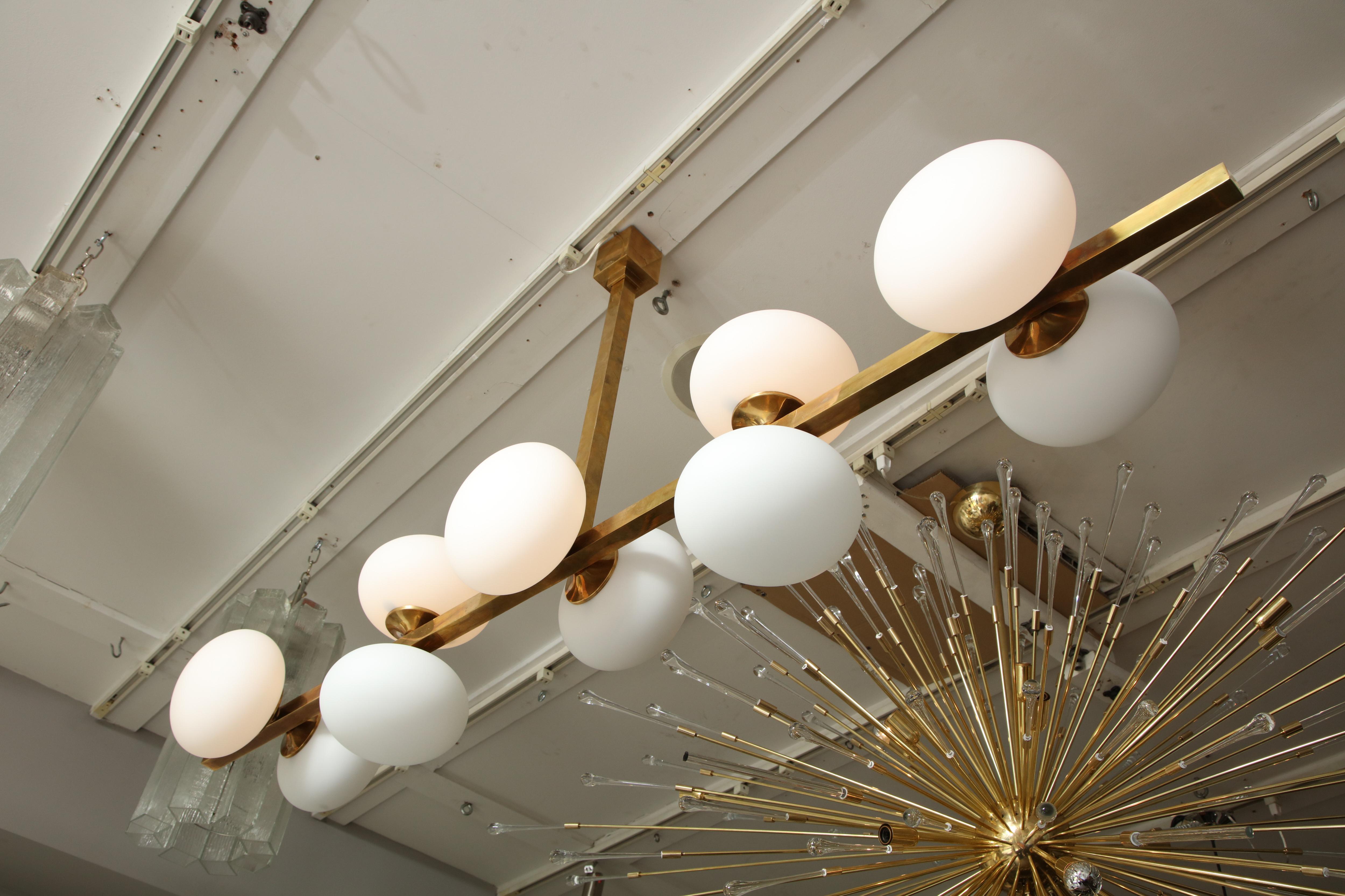 Italian Ten Elongated Opaline Glass Globe Chandelier For Sale