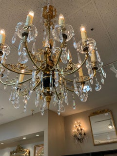 Italian ten light crystal chandelier, black marble accents with brass arms