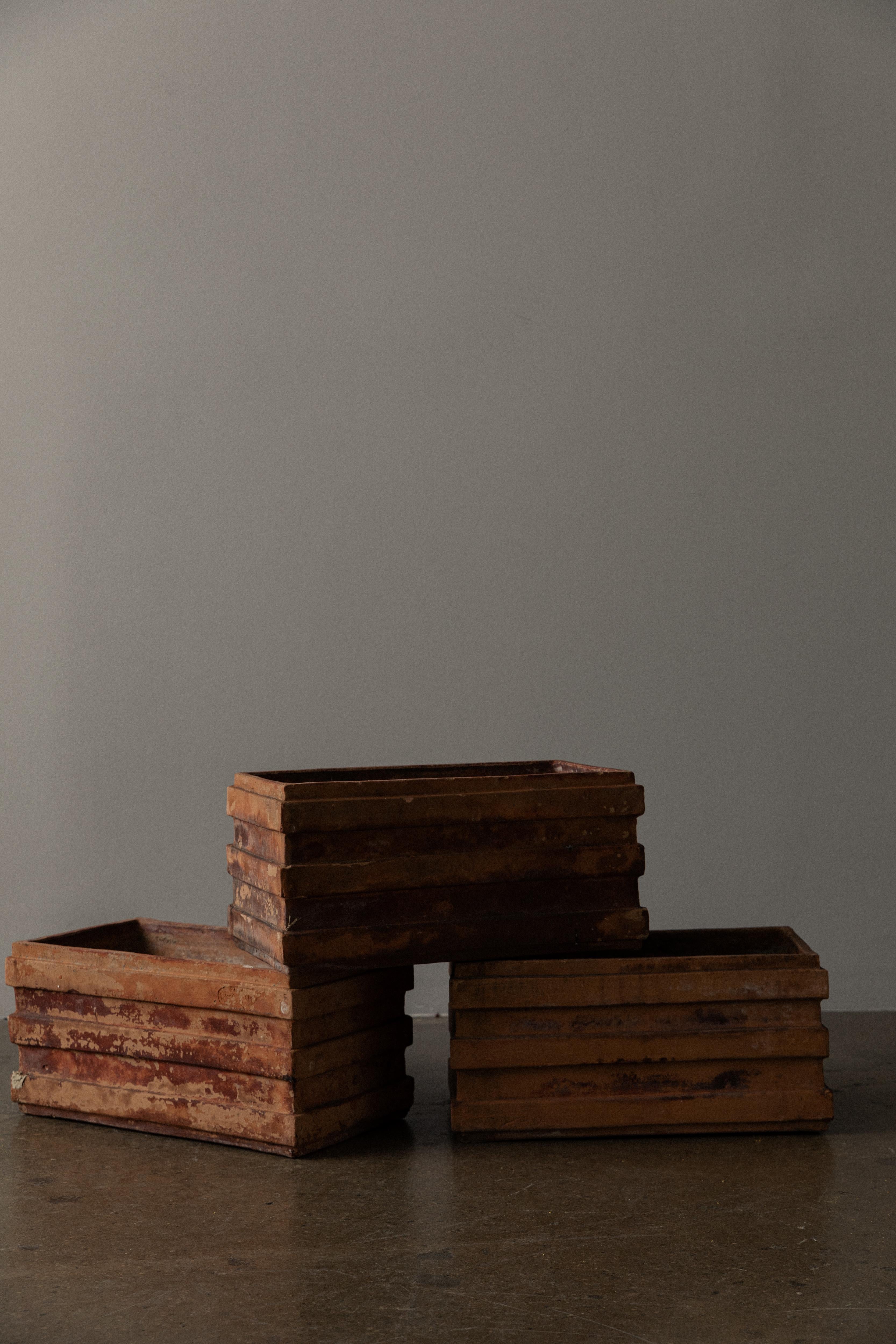 The terracotta rectangular planter is a versatile accessory. Crafted from terracotta clay, the planter features a sleek and modern design with clean lines. Its rectangular shape allows for a variety of options for use, especially planting. It Is