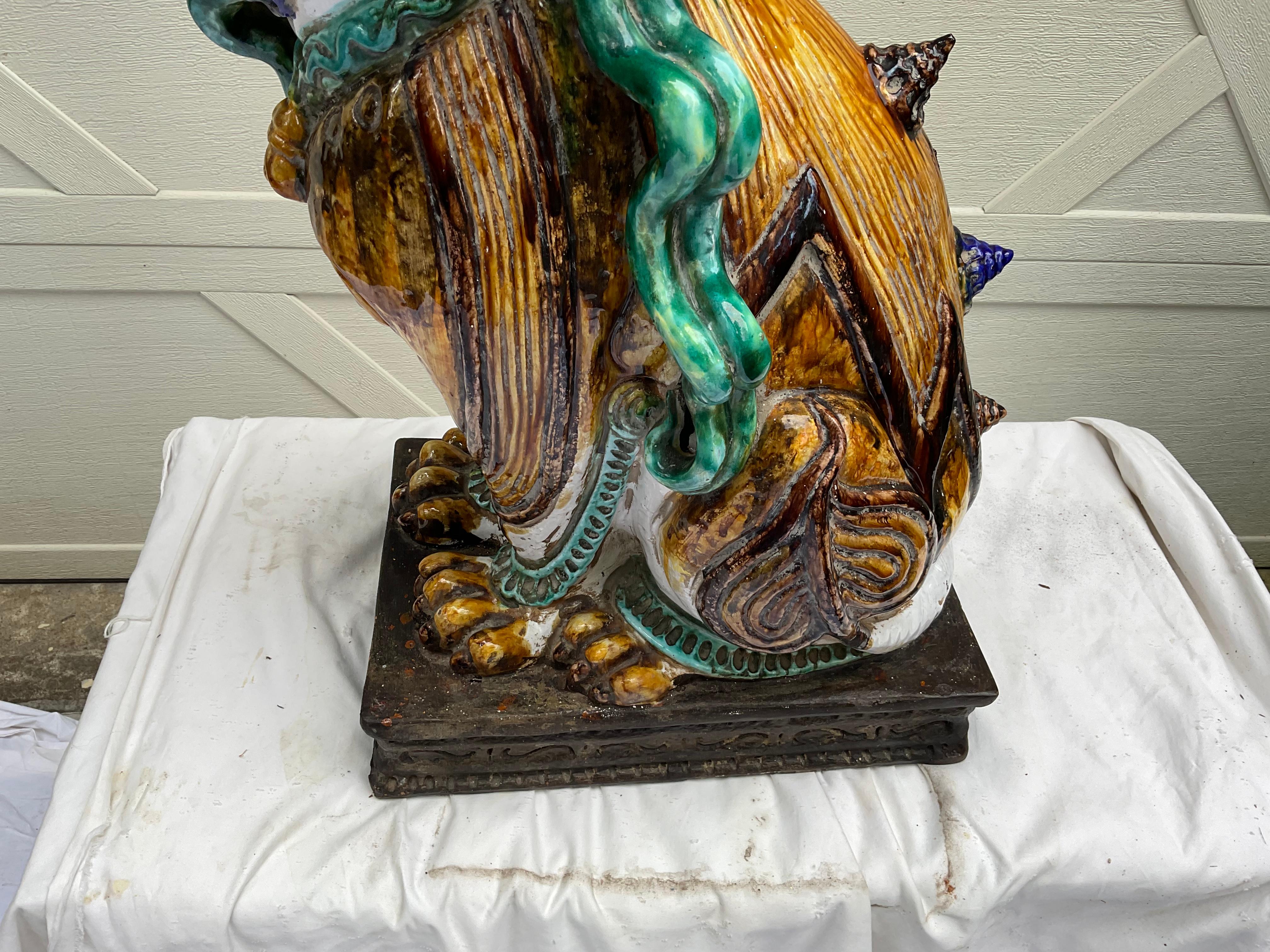I love this multicolored, embellished foo dog. Quite a statement piece! In very good condition, with 1 corner having an old repair. Typical of terracotta, so please be careful while moving. Very hard to find, this particular style of foo. Only one,