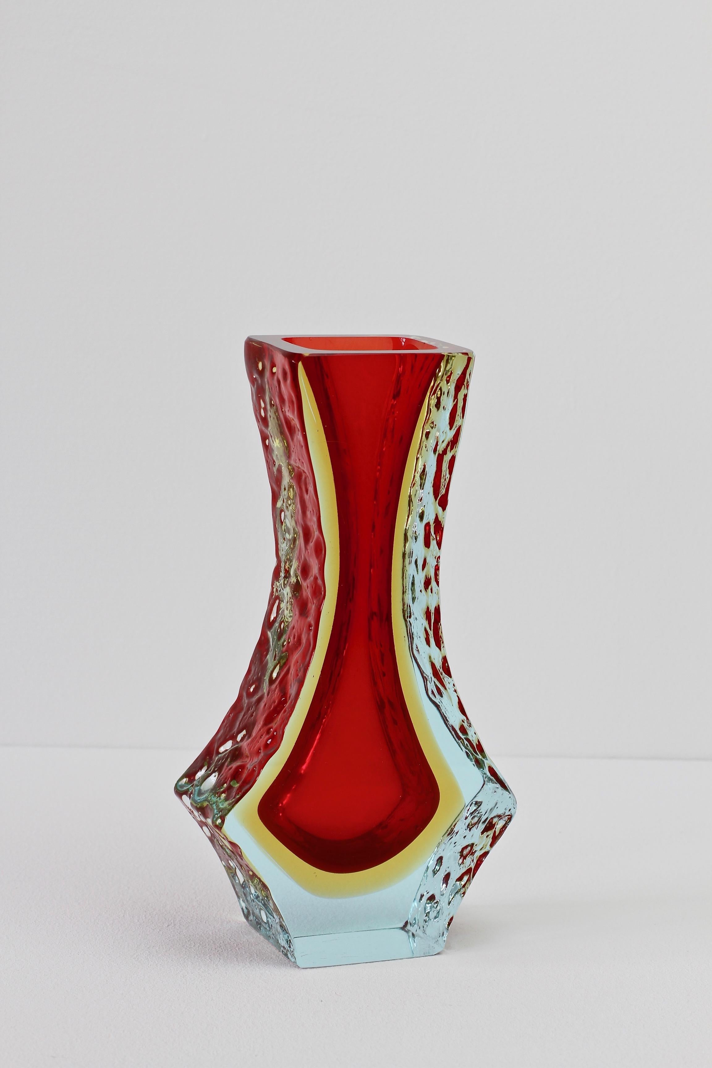 Vintage Italian midcentury textured Murano art glass vase attributed to Mandruzzato. Beautiful color (color) combination of light blue over yellow over ruby red- the textured 'Sommerso' ice glass looks simply stunning.
