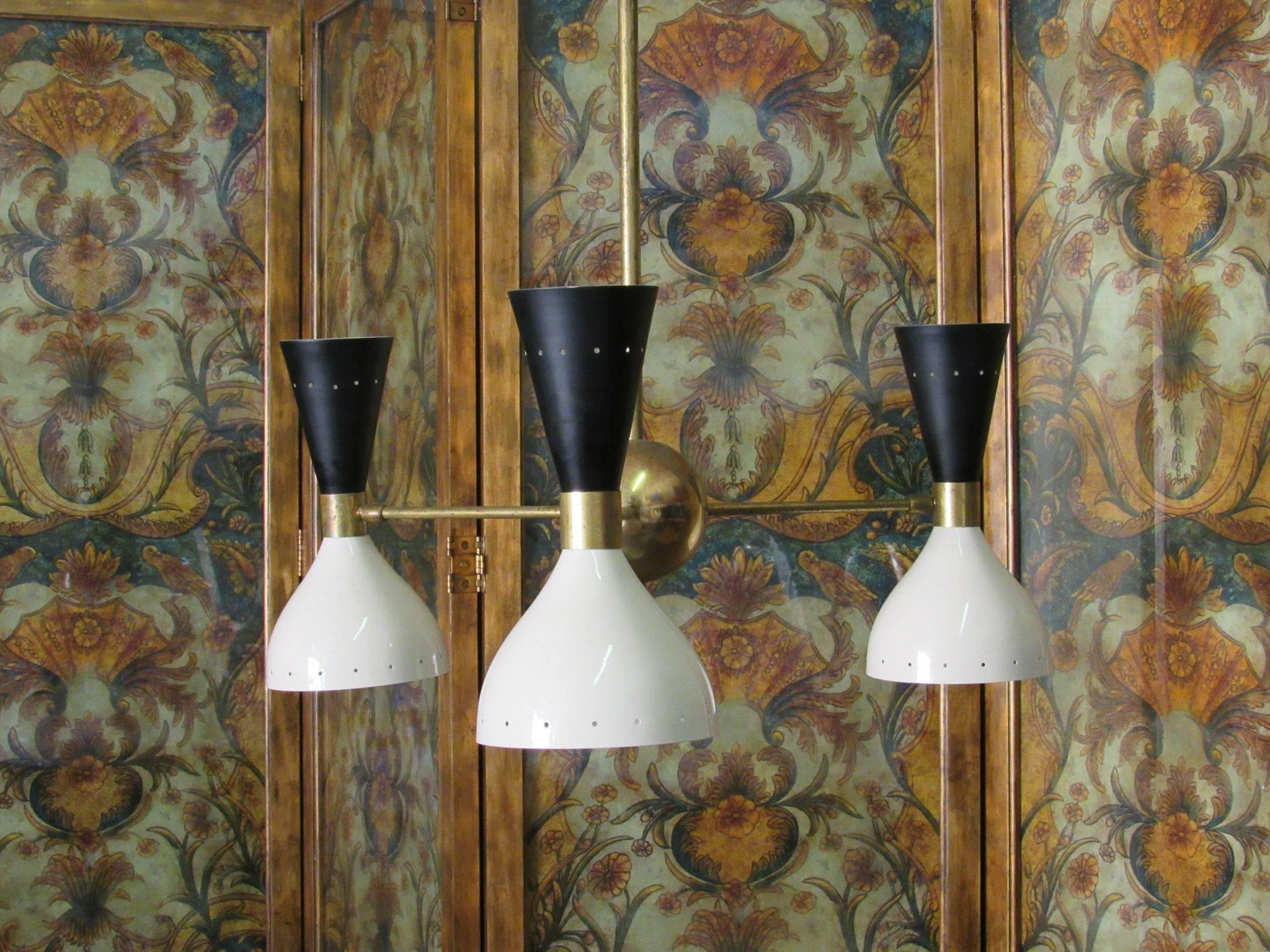 Three-arm articulating Italian ceiling light with brass centre globe and three black and white perforated shades. The shades have been repainted and restored, all new sockets and rewiring. Ready to be installed. 

Shades: Each shade is