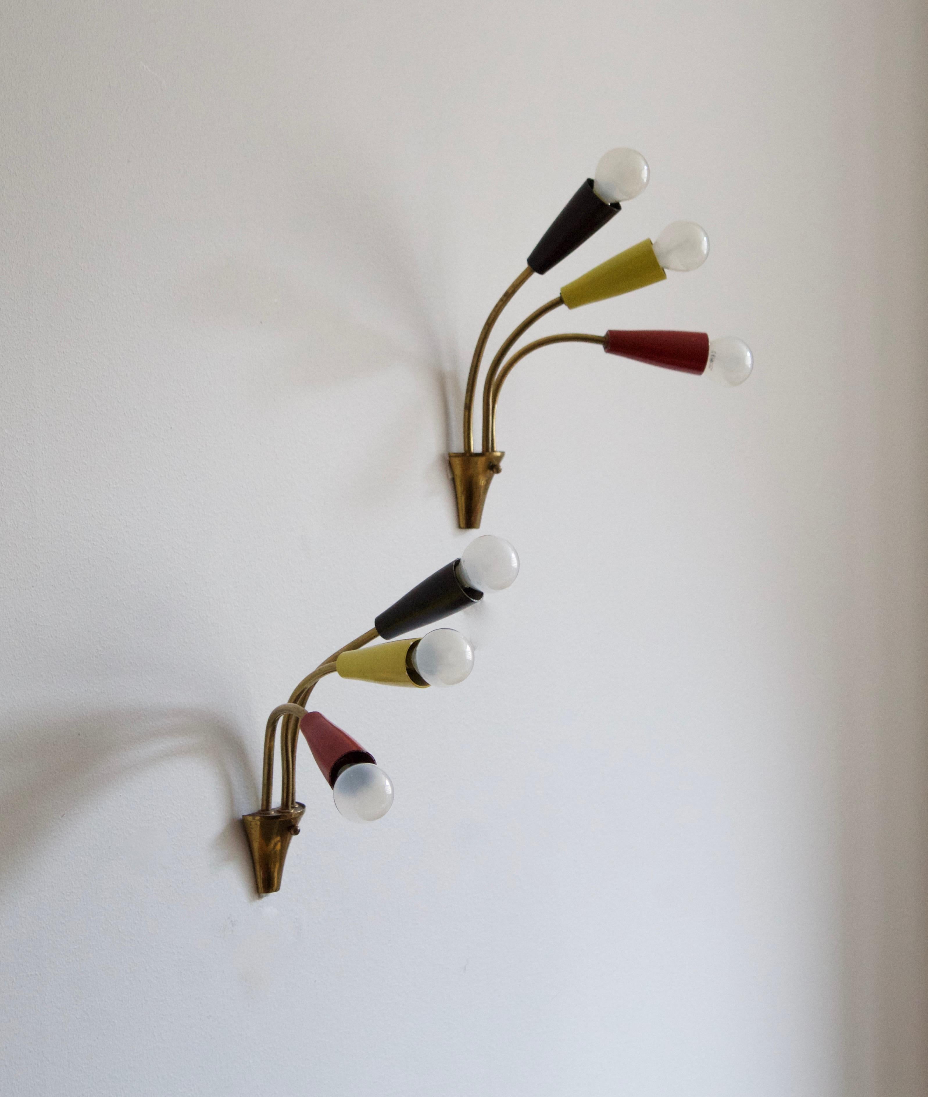 A pair of wall lights / sconces. Designed and produced in Italy, 1950s. Features brass and lacquered metal in red, yellow and black.
