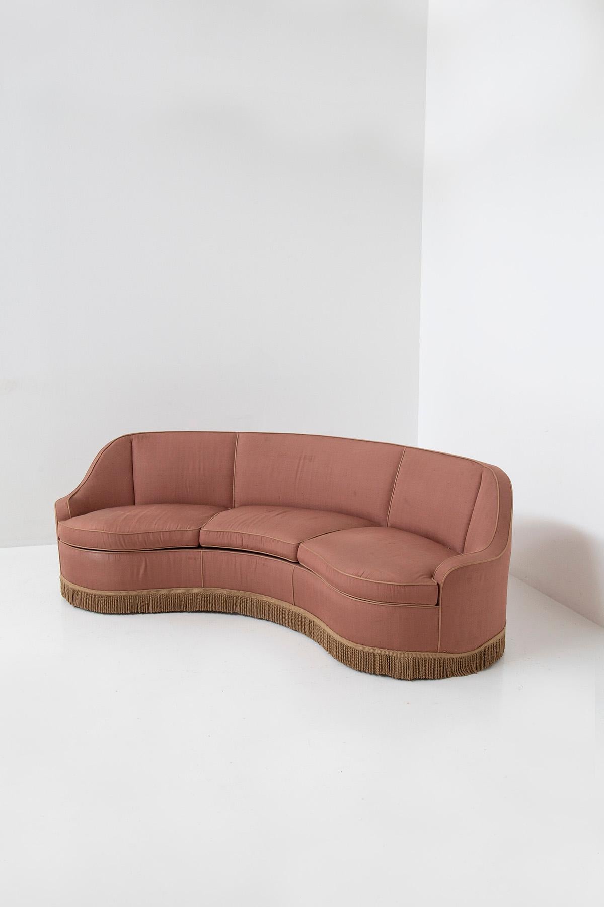 The delightful three-seater sofa attributed to the esteemed 1950s designer Gio Ponti is a remarkable piece of furniture for Casa e Giardino . By purchasing this sofa, you not only take home an elegant and original Italian sofa, but also a