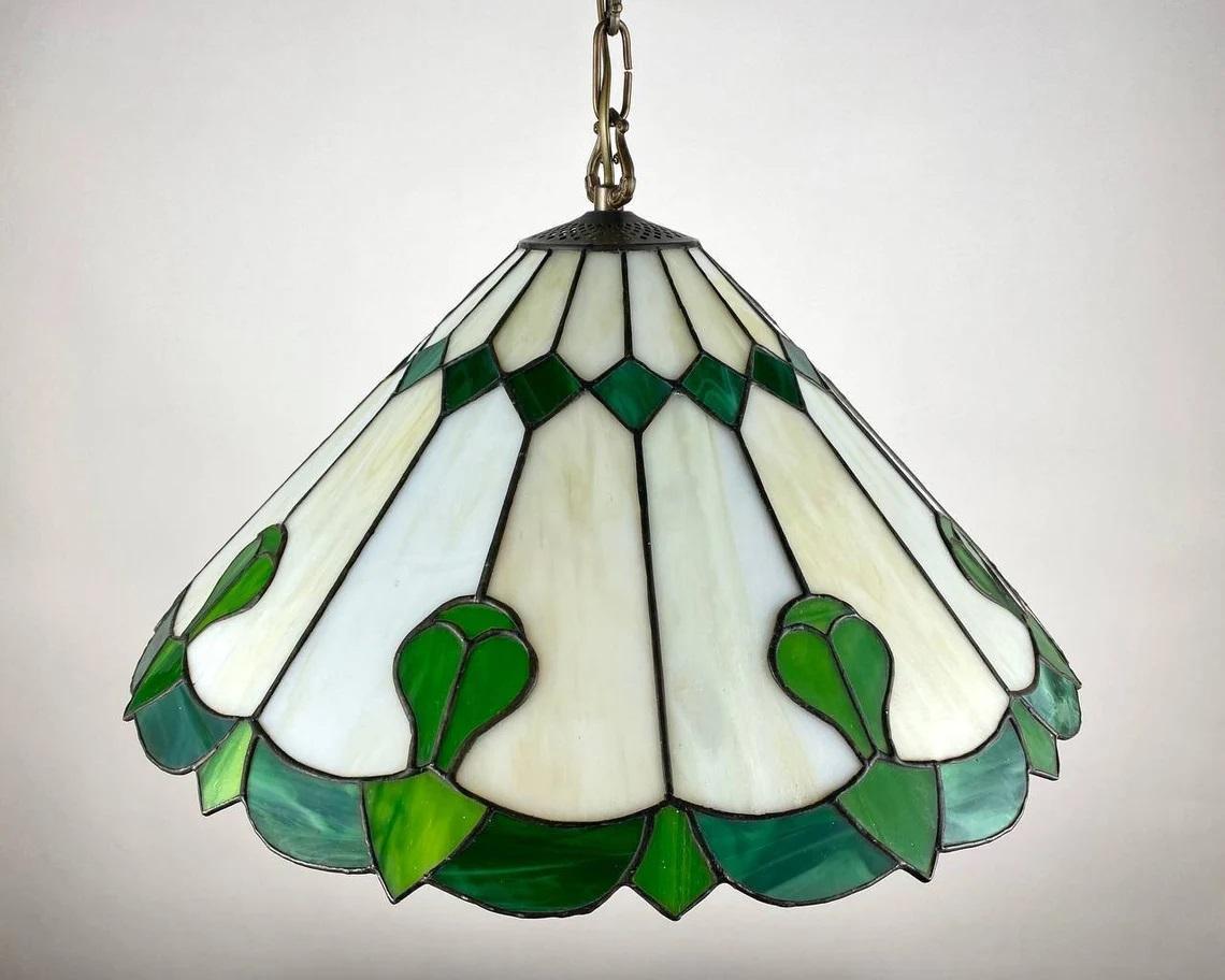 Vintage green Tiffany Chandelier. Italy, 1970s.

Stained glass Tiffany chandelier geometric art deco. Marble and green glass according to the traditional technique of the first manufacturer Louis Comfort Tiffany.

Chandelier is handcrafted by