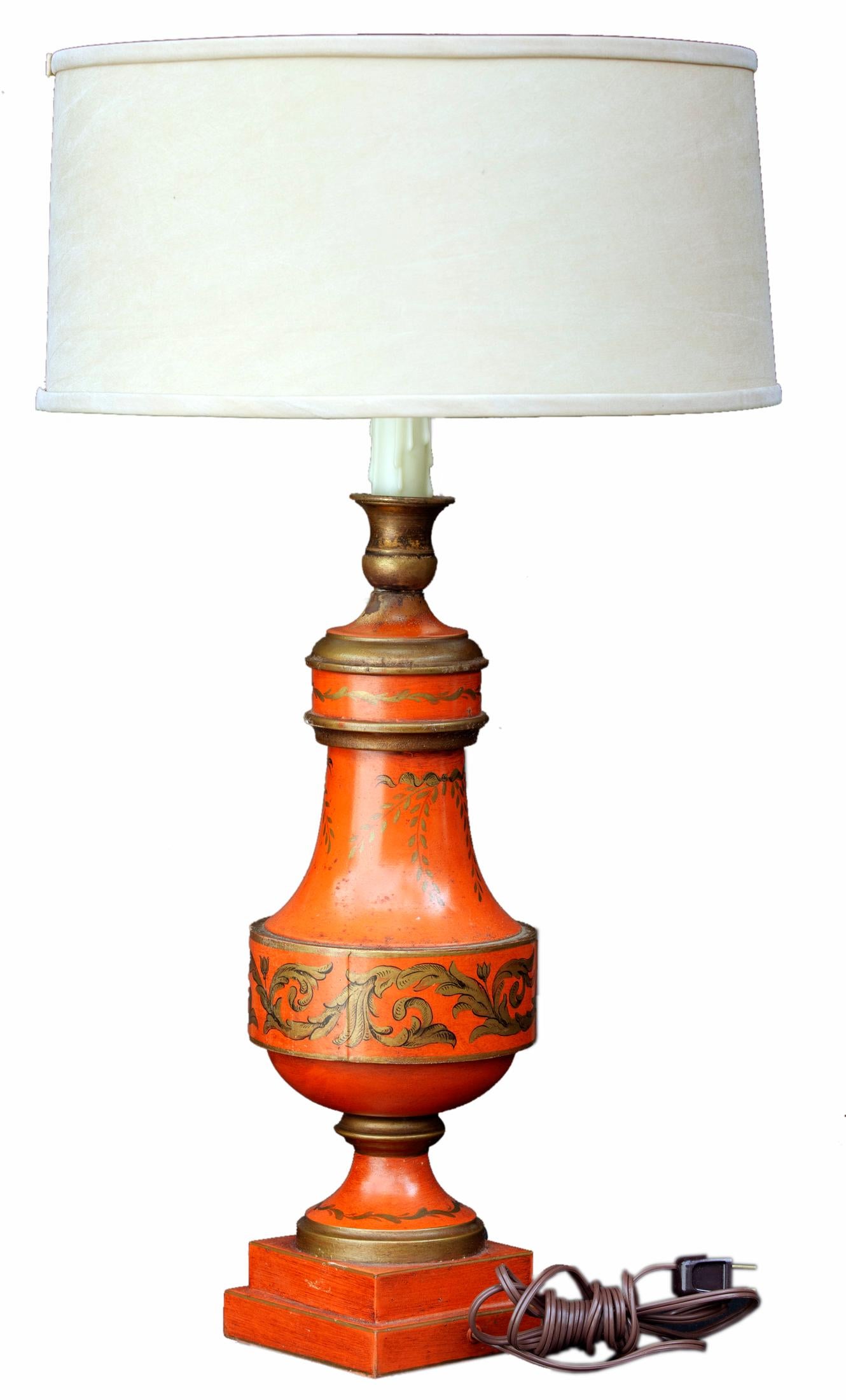 Italian toile lamp in Venetian red, decorated with gold scroll work.
