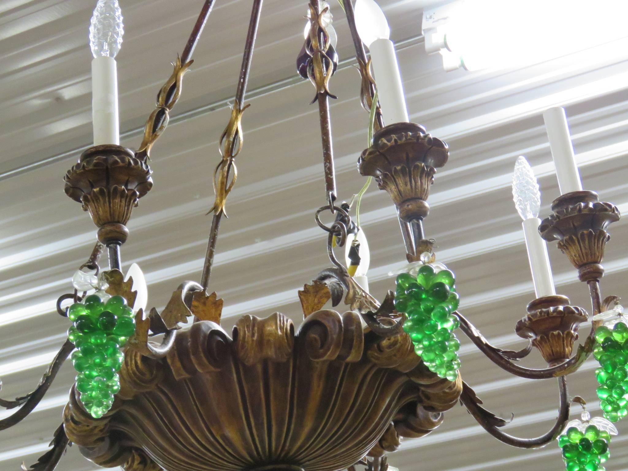 Italian tole and crystal eight-arm chandelier with green glass grapes.