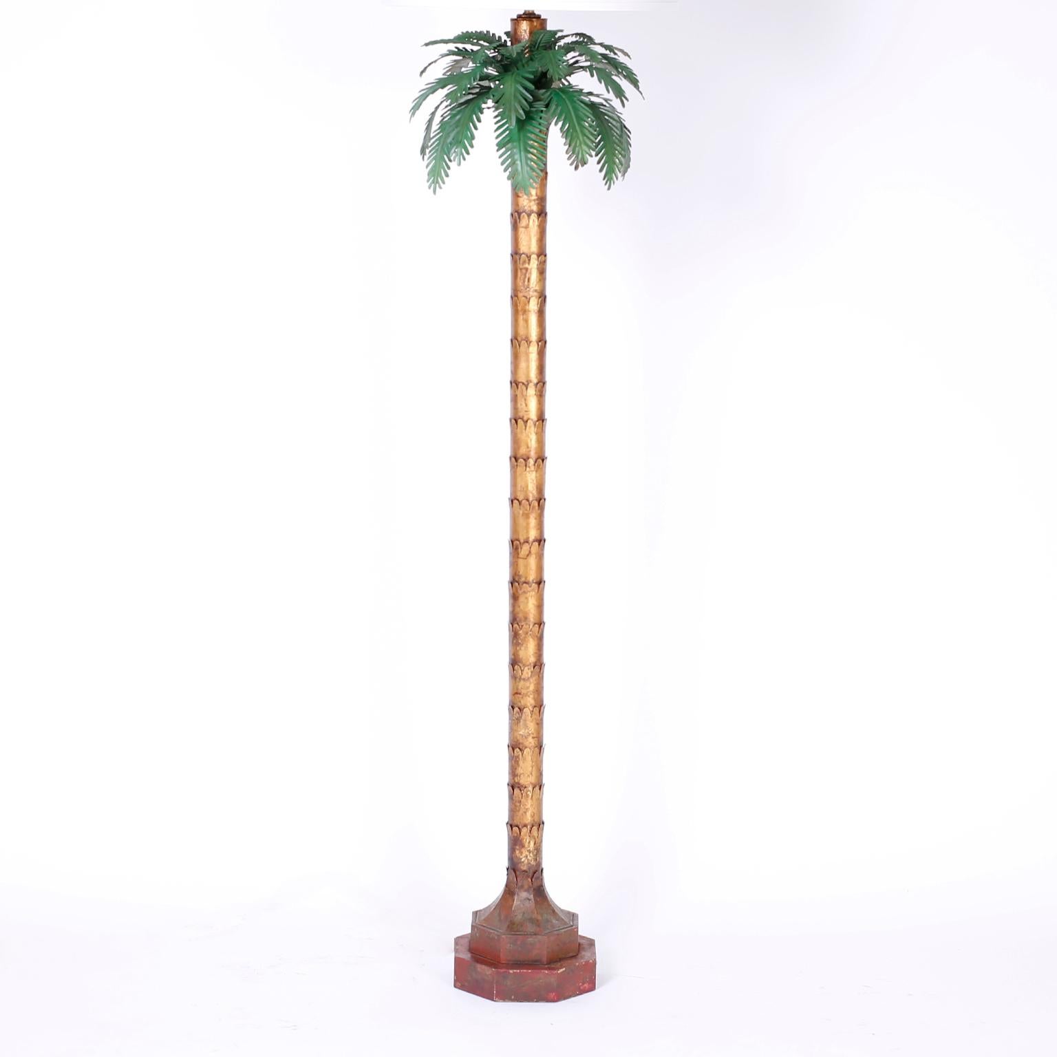With a combination of old world charm and modern elegance this Palm Tree floor lamp delivers. The tole leaves are understated and supported by a gilt metal stylized trunk rising from a worn faux marble double plinth base.