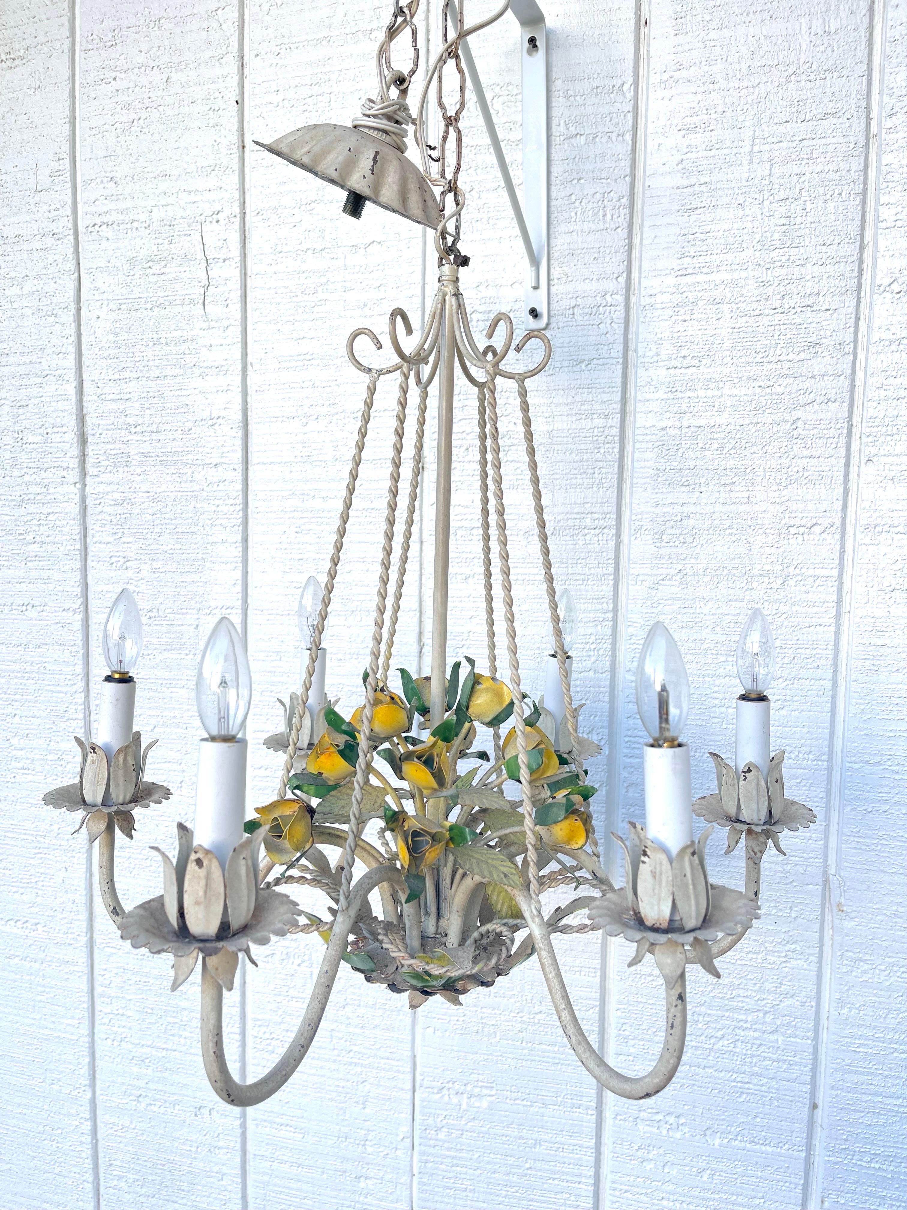 Italian Tole Floral Bouquet in Basket Chandelier. Gorgeous yellow flowers so happy and vibrant. Adorable custom Shades of Gingham green. Perfect to bring color and warmth to any room.
Measurement of chandelier chain is an additional 18.5