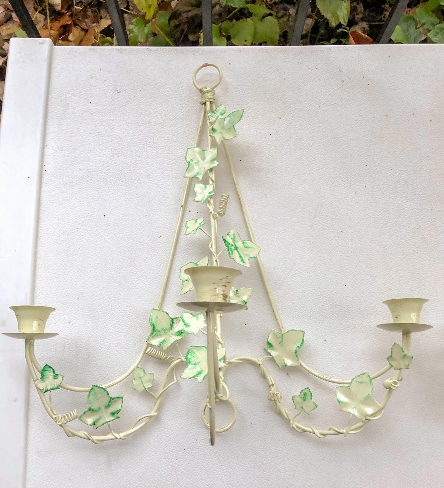 Wonderful pair of painted metal tole Italian ivy motif candle wall sconces, circa 1960s. Each measures 15.5