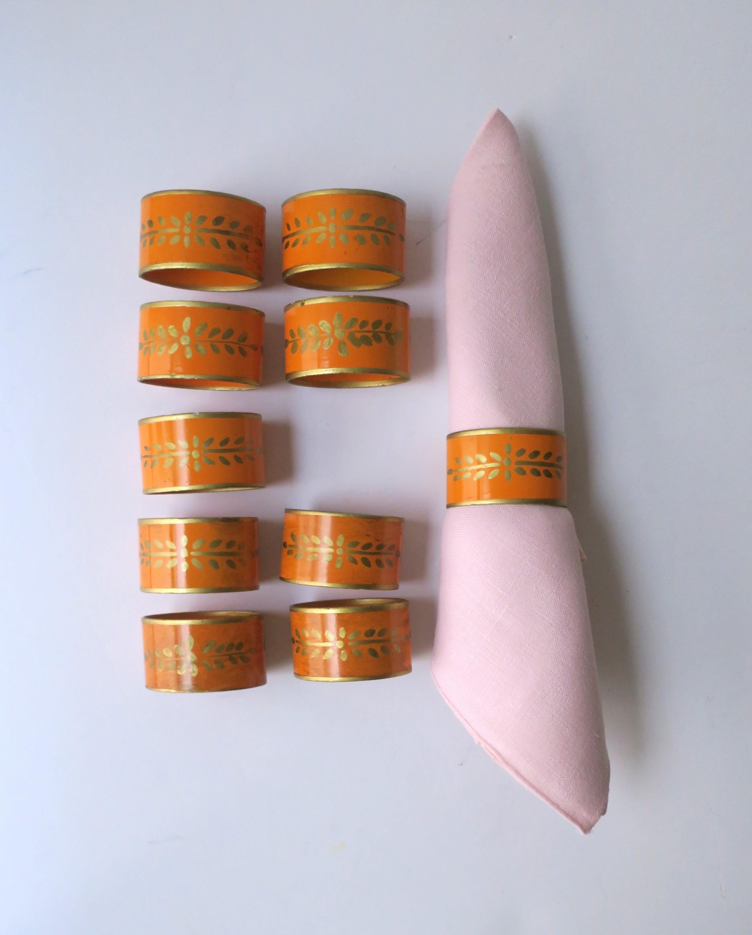A great set of ten (10) Italian tole napkin ring holders in orange and gold, circa mid-20th century, Italy. Set is an orange enamel with gold hand-painted design. Marked 'Made in Italy' as shown in images. A great set for a dining table, creating