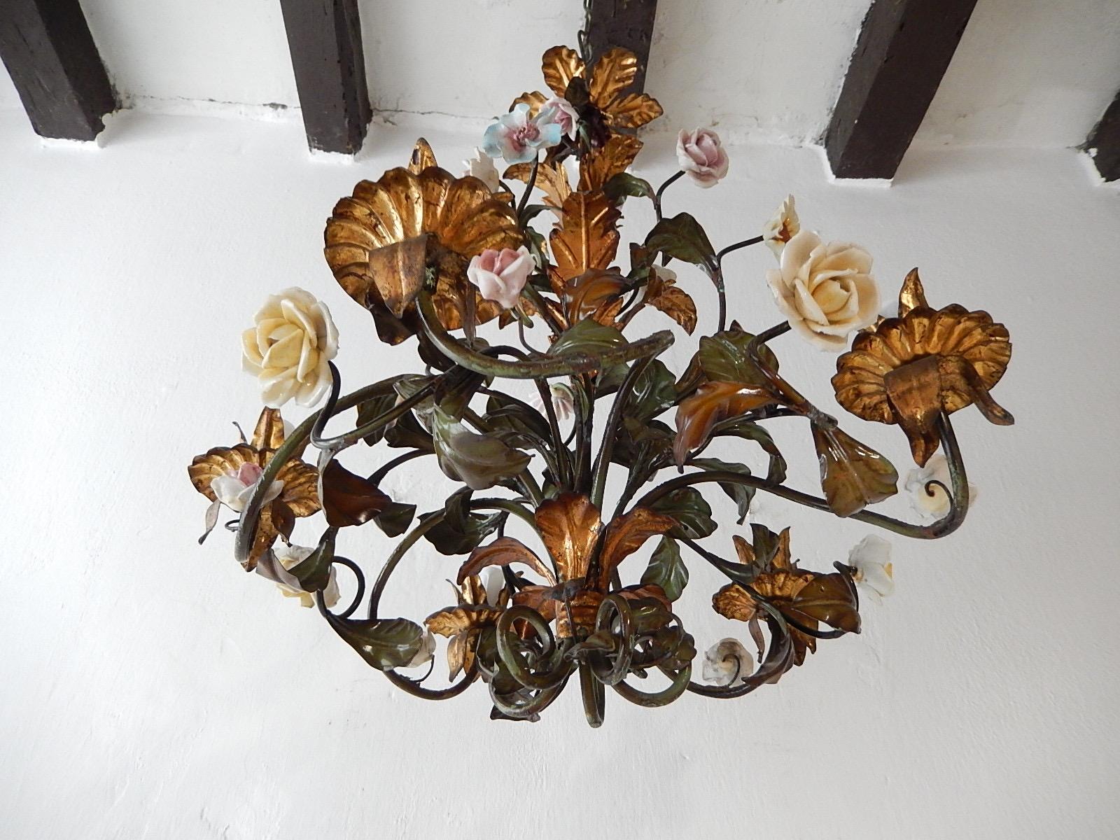 Housing 5 lights, rewired and ready to hang.  Original color tole leaves. Gorgeous handmade roses and flowers! All intact. Gold gilded accents. Extremely rare bottom.  Adding 8” of original chain. Free priority shipping UPS from Italy.