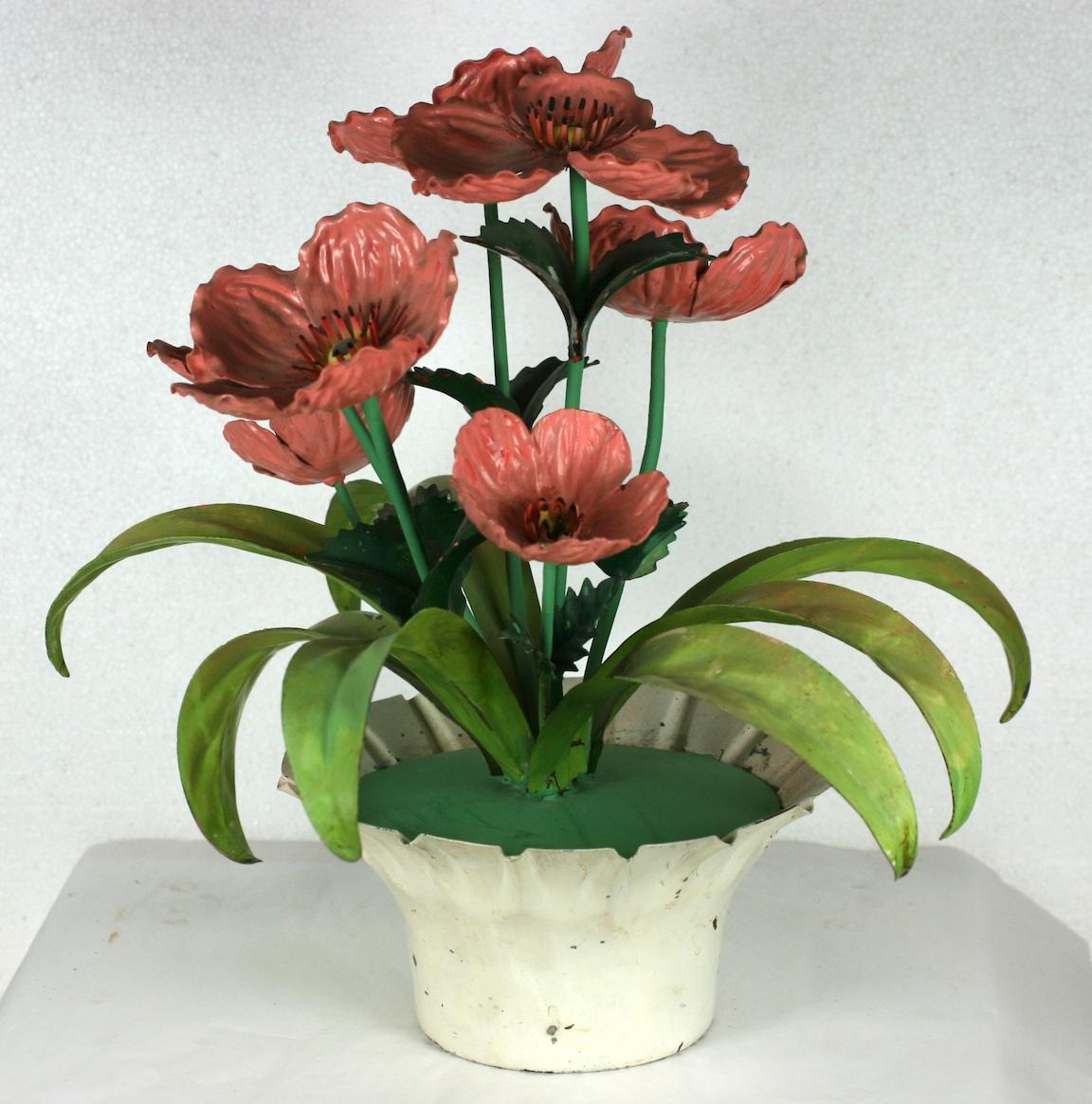 Italian cold painted tole poppies table ornament. The white scalloped footed pot holds a symmetrical cluster of large and small metal poppies in varied shades of pinky orange. The leaves are enameled in ombre greens.
Original paper label.
Good