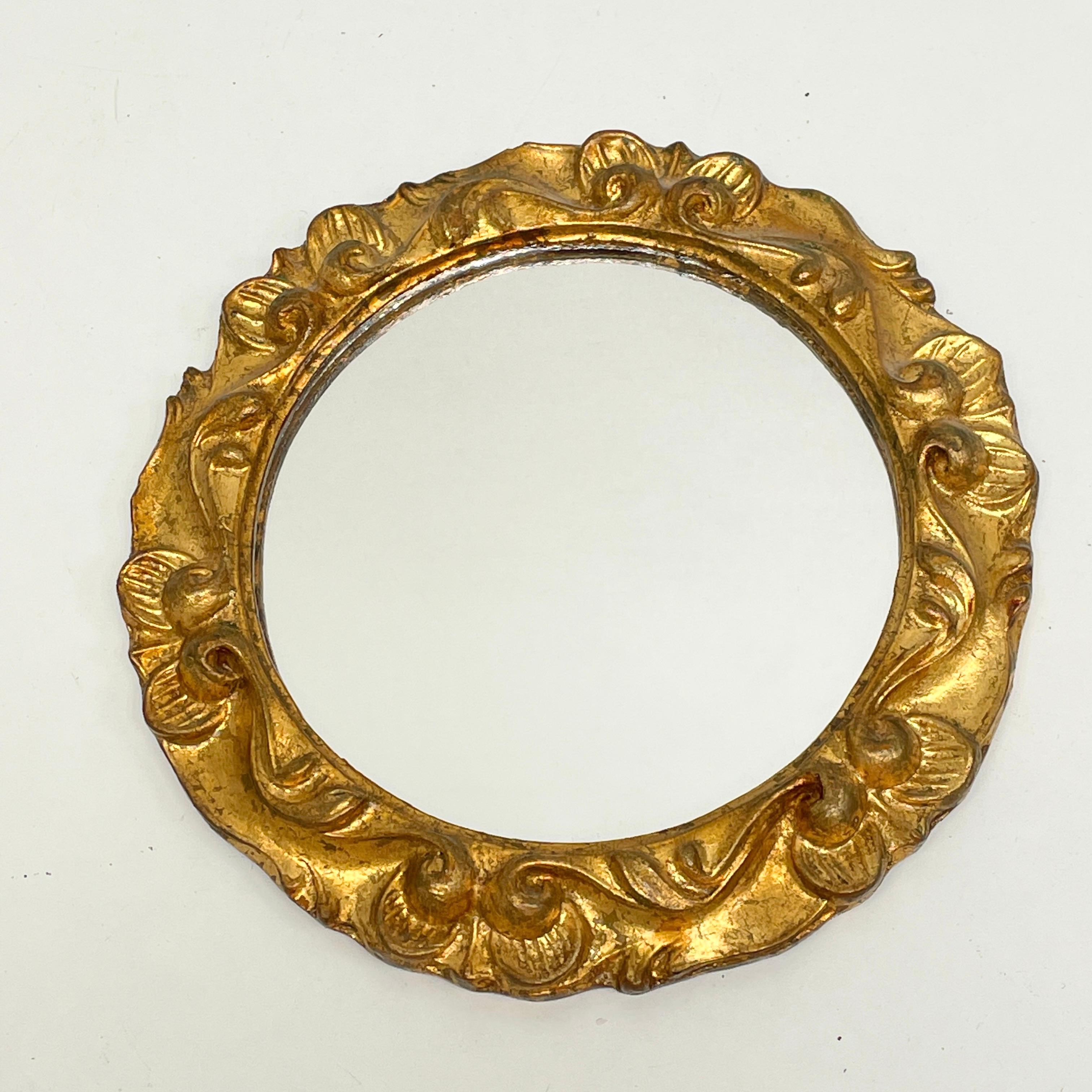 A gorgeous toleware mirror. Made of giltwood and composition. It measures approximate 9 1/4