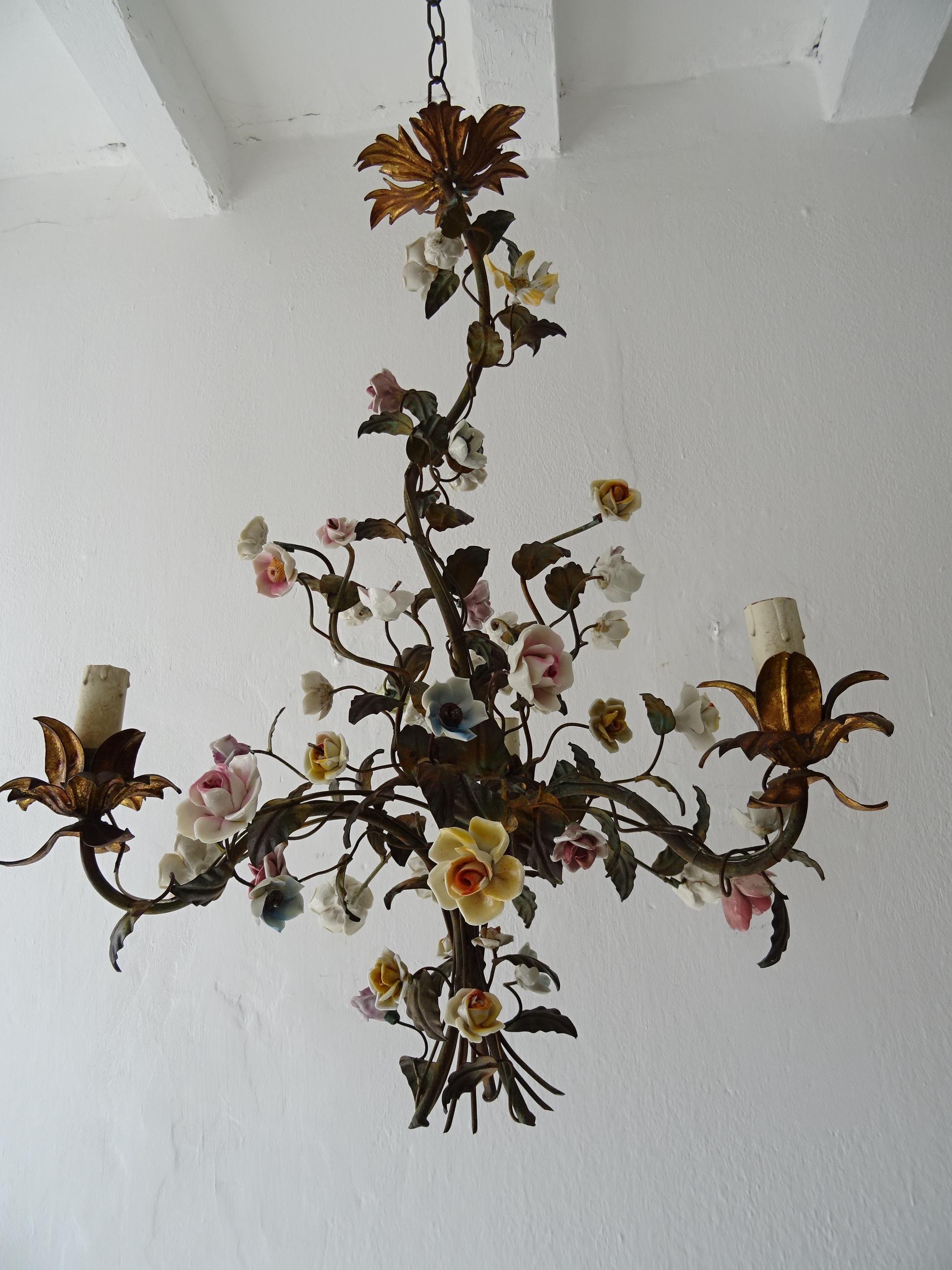Housing 3 lights. Original color tole with gold bulb holders, top and canopy. Big and small handmade porcelain flowers. Extremely rare, these were never exported to the USA. Adding 12 inches of original chain and canopy. Will be newly re-wired with