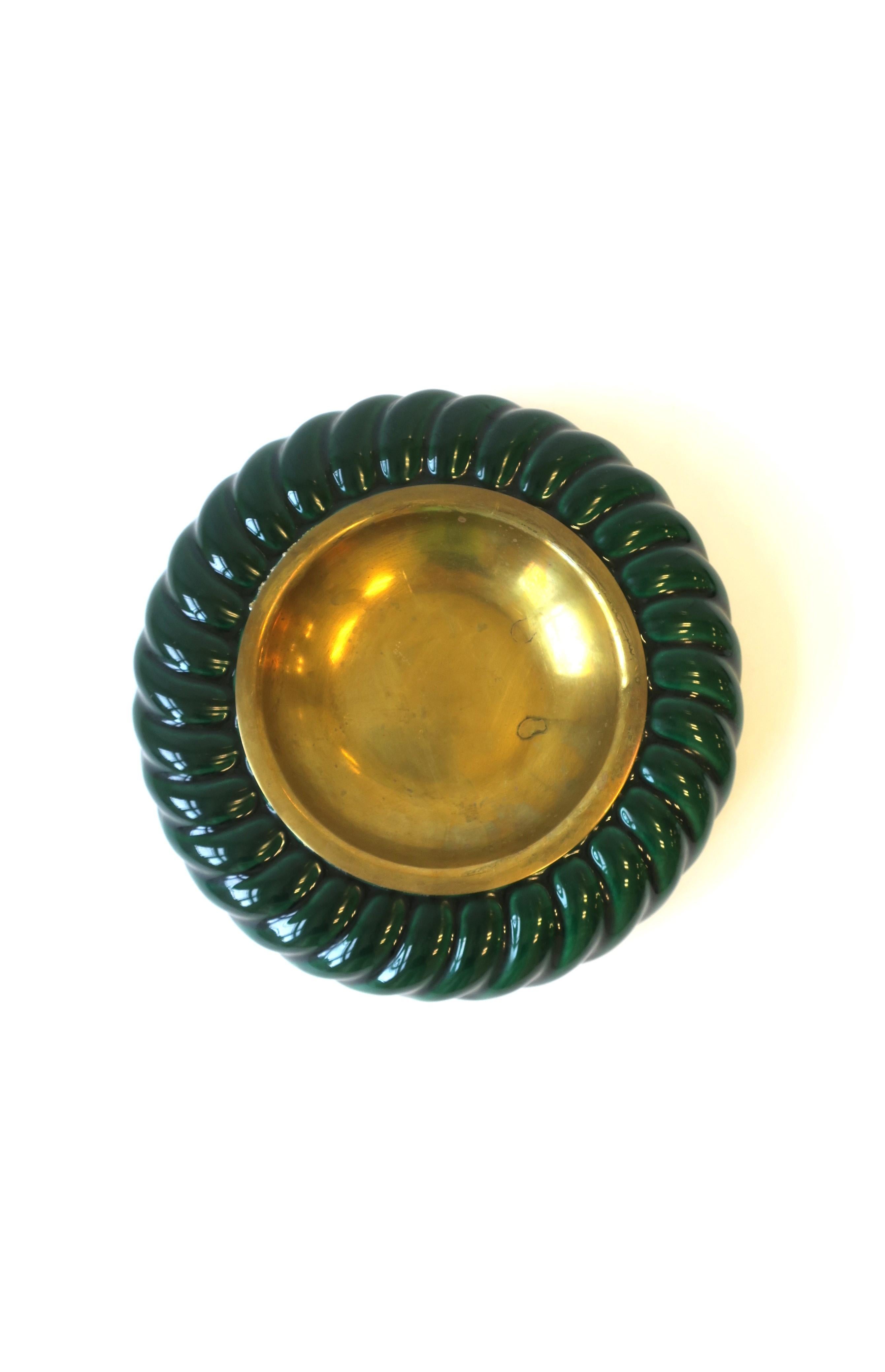 A beautiful Italian brass and green ceramic vide-poche catchall, by Italian designer Tommaso Barbi, '70s Modern period, Italy. Piece is by Italian designer Tommaso Barbi in a green glazed ceramic with brass center. A great piece to hold jewelry or