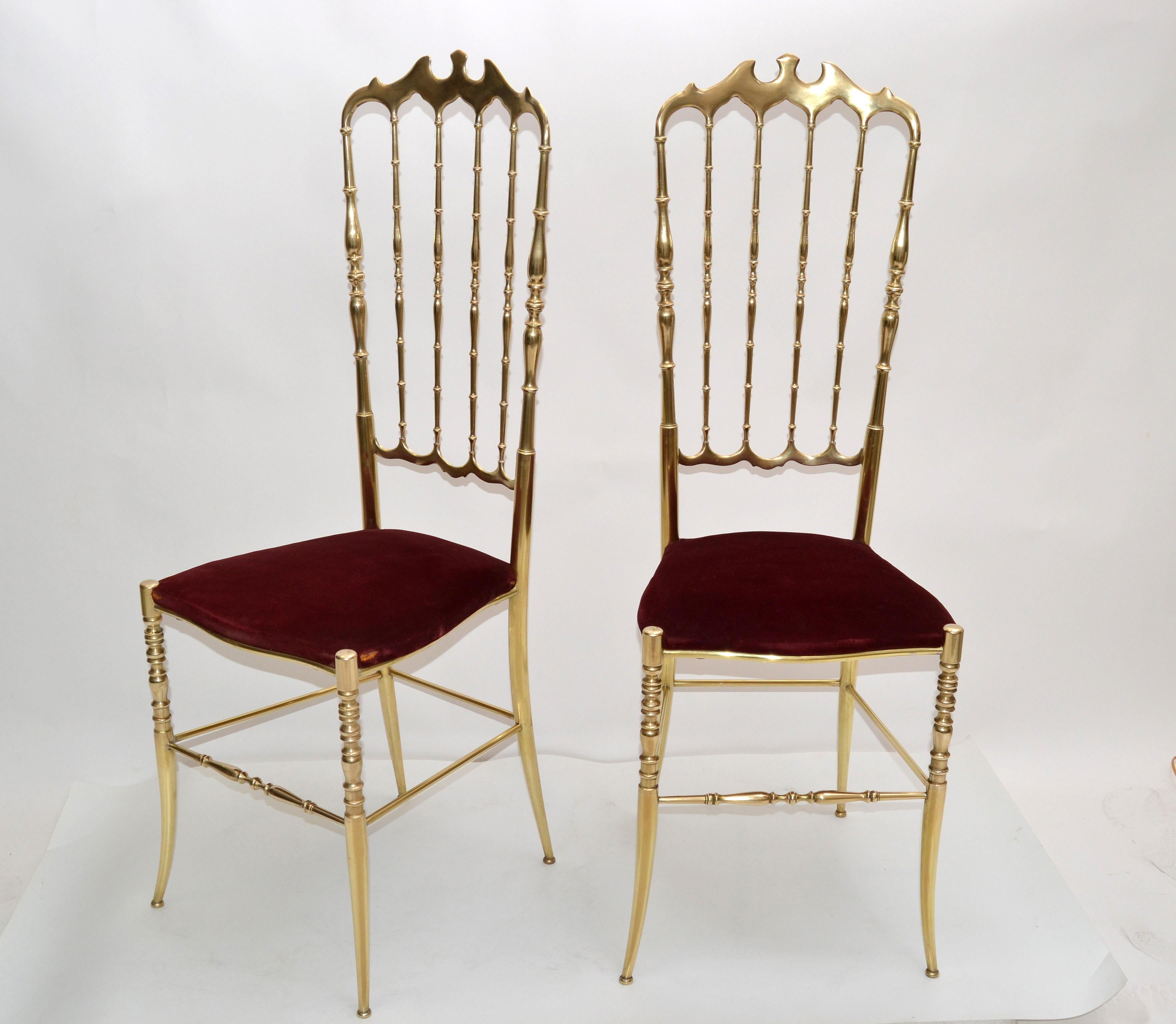 Pair of Mid-Century Modern high back bronze Chiavari chairs made in Italy, circa 1950. 
The pair retains the original red Velvet seat. 
Similar chairs are at the Le Crystal Room Restaurant of Maison Baccarat, Place des Etats Unis in Paris which