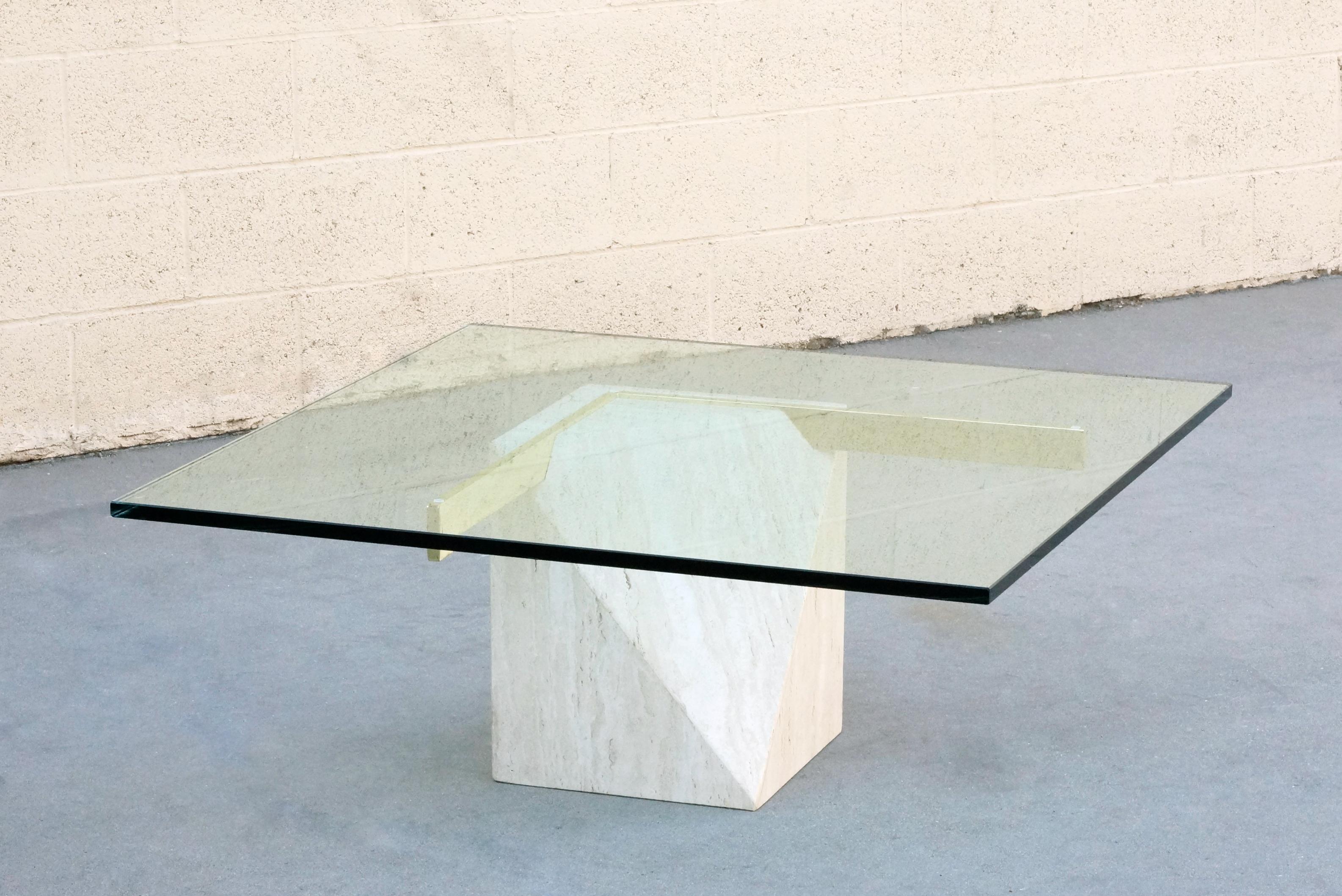 Classic 1970s Italian travertine and brass coffee table by Artedi. Thoughtfully designed geometric base with cantilevered glass top. 

Dimensions: 40