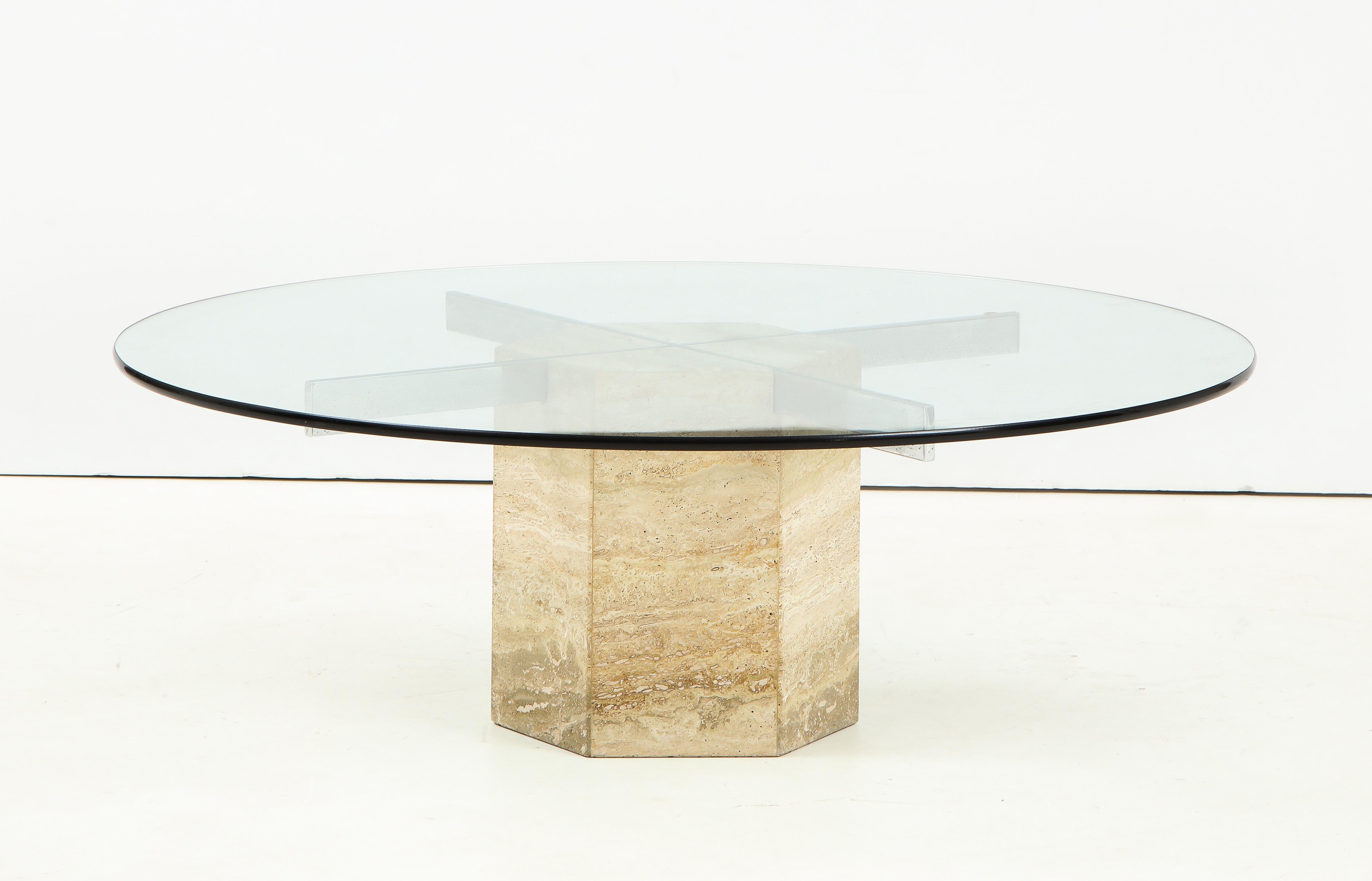 Italian coffee table with circular glass top supported by chrome inset to hexagonal shaped travertine base.
Italy, circa 1960
Size: 14 1/4