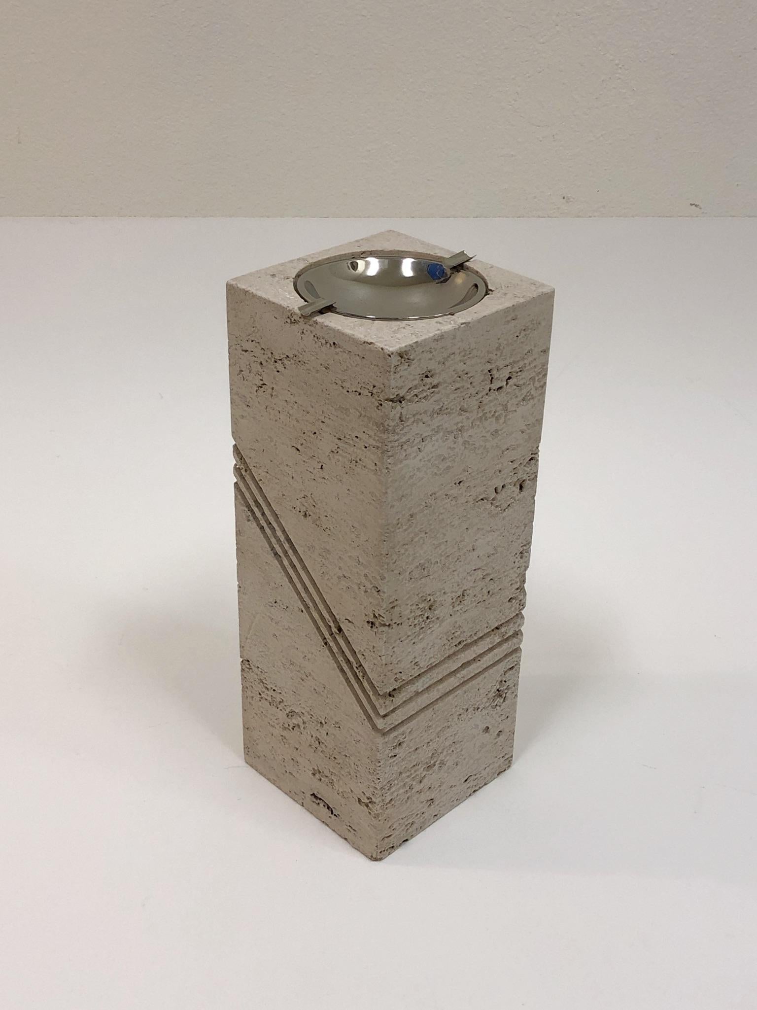 A glamorous solid Italian travertine and polish nickel freestanding ashtray by Marble Art Italy

Dim: 15.75” high 6” deep 6” wid