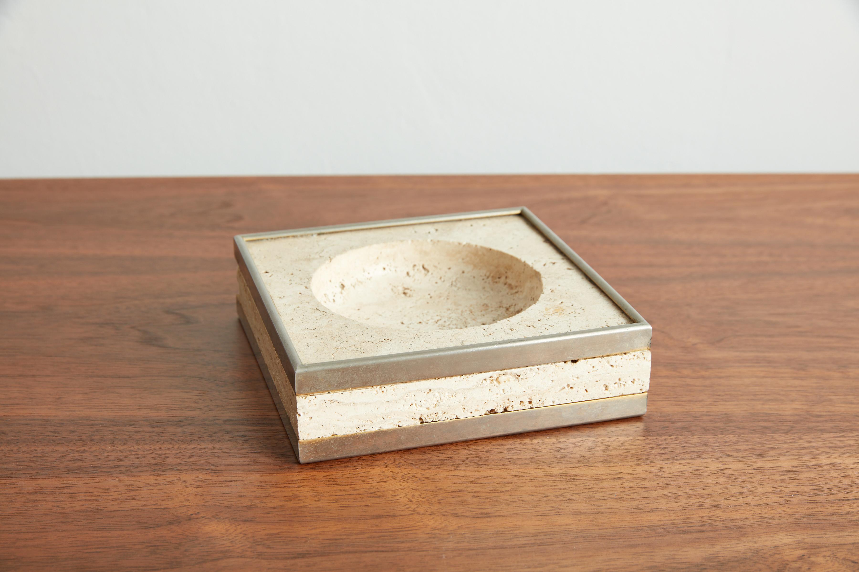 Handsome travertine stone ashtray with chrome edging detail.
Great for any desk to hold paperclips etc!
Italy, 1970s.
