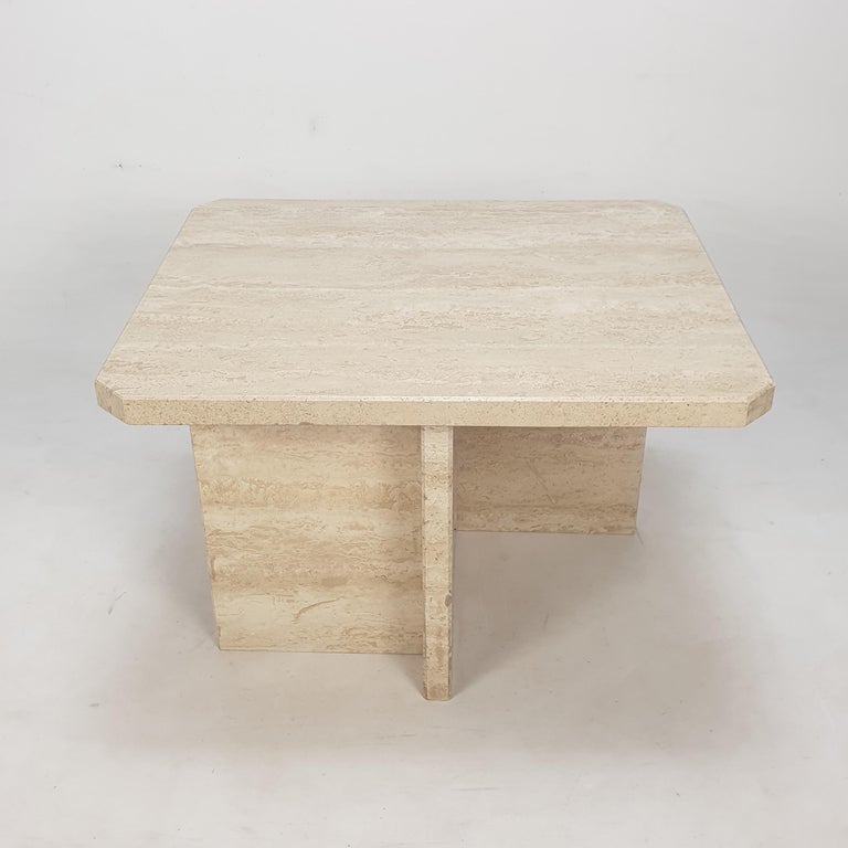 Very nice Italian coffee table from the 80's, handcrafted out of travertine. 

It has a thick and solid rectangle top. 

The plate and the base are made of very nice travertine.