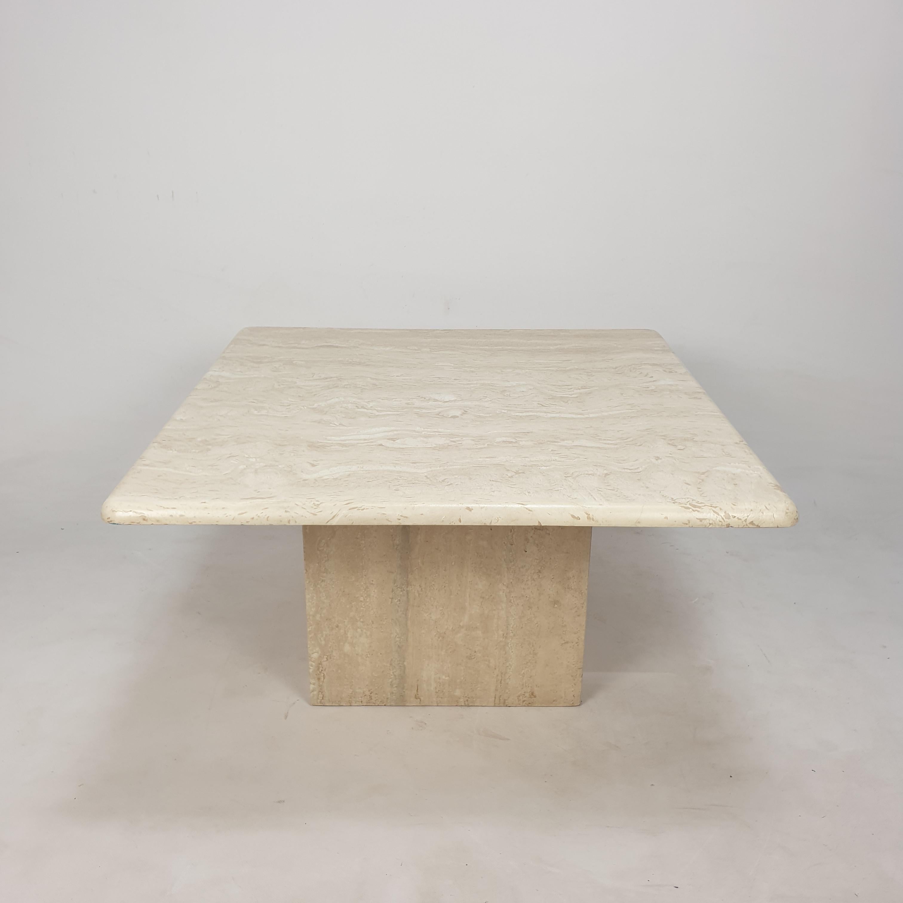 Very nice Italian coffee table from the 80's, handcrafted out of travertine. 

The top is rounded on the edge. 

The plate and the base are made of very nice travertine.