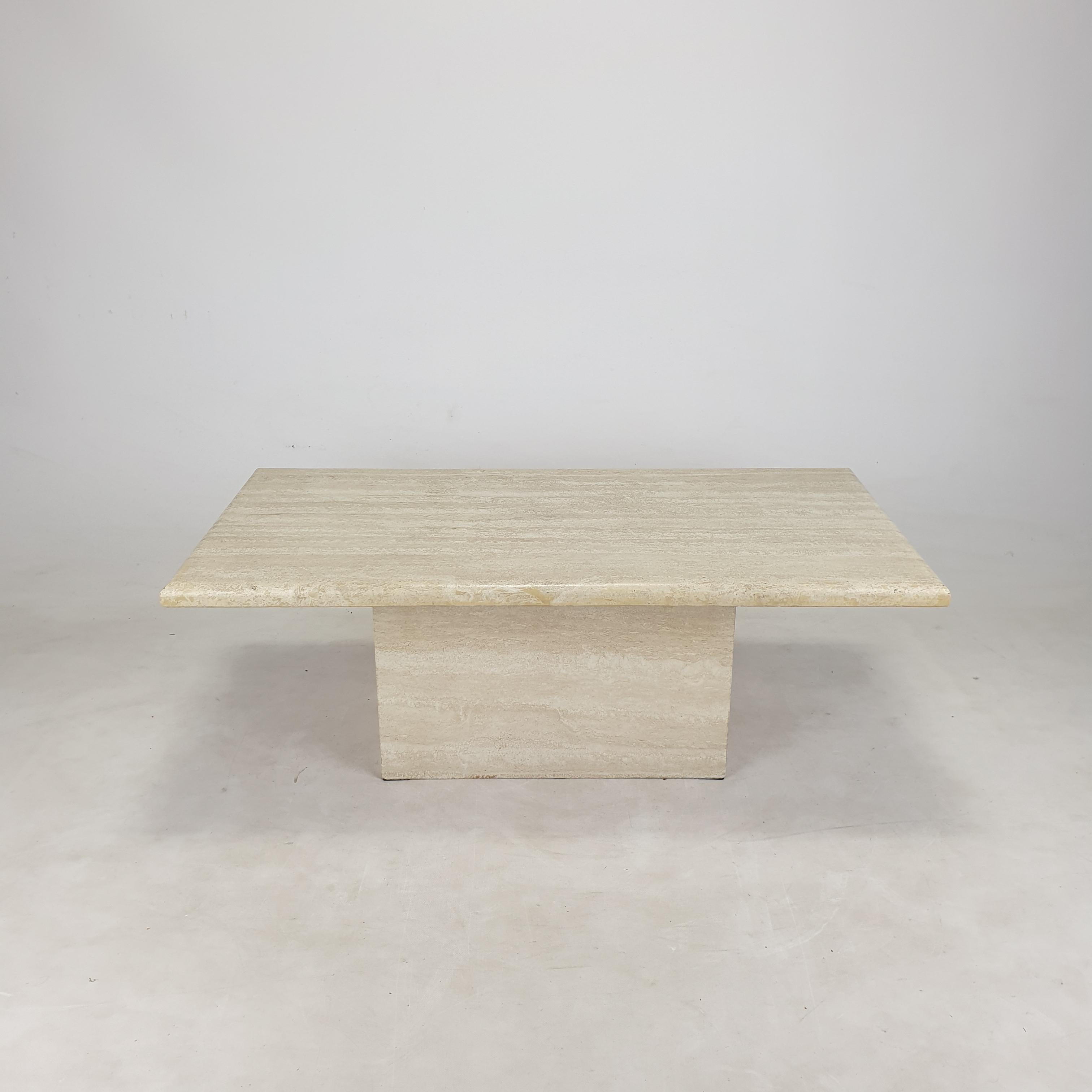 Very nice Italian coffee table from the 80's, handcrafted out of travertine. 

The plate and the base are made of very nice travertine.