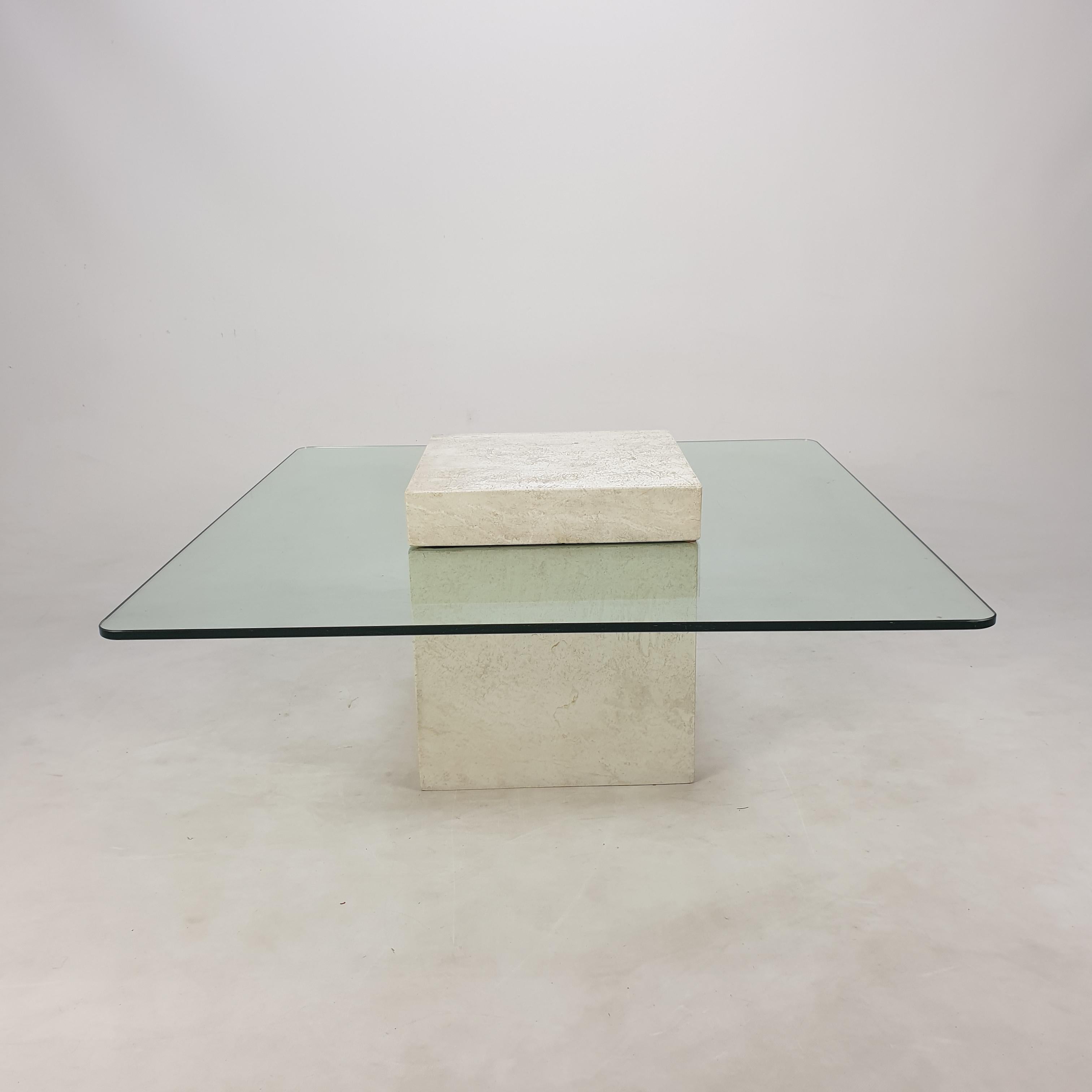 Very nice Italian coffee table from the 80's, handcrafted out of travertine. 

A glass plate and the base is made of very nice travertine.