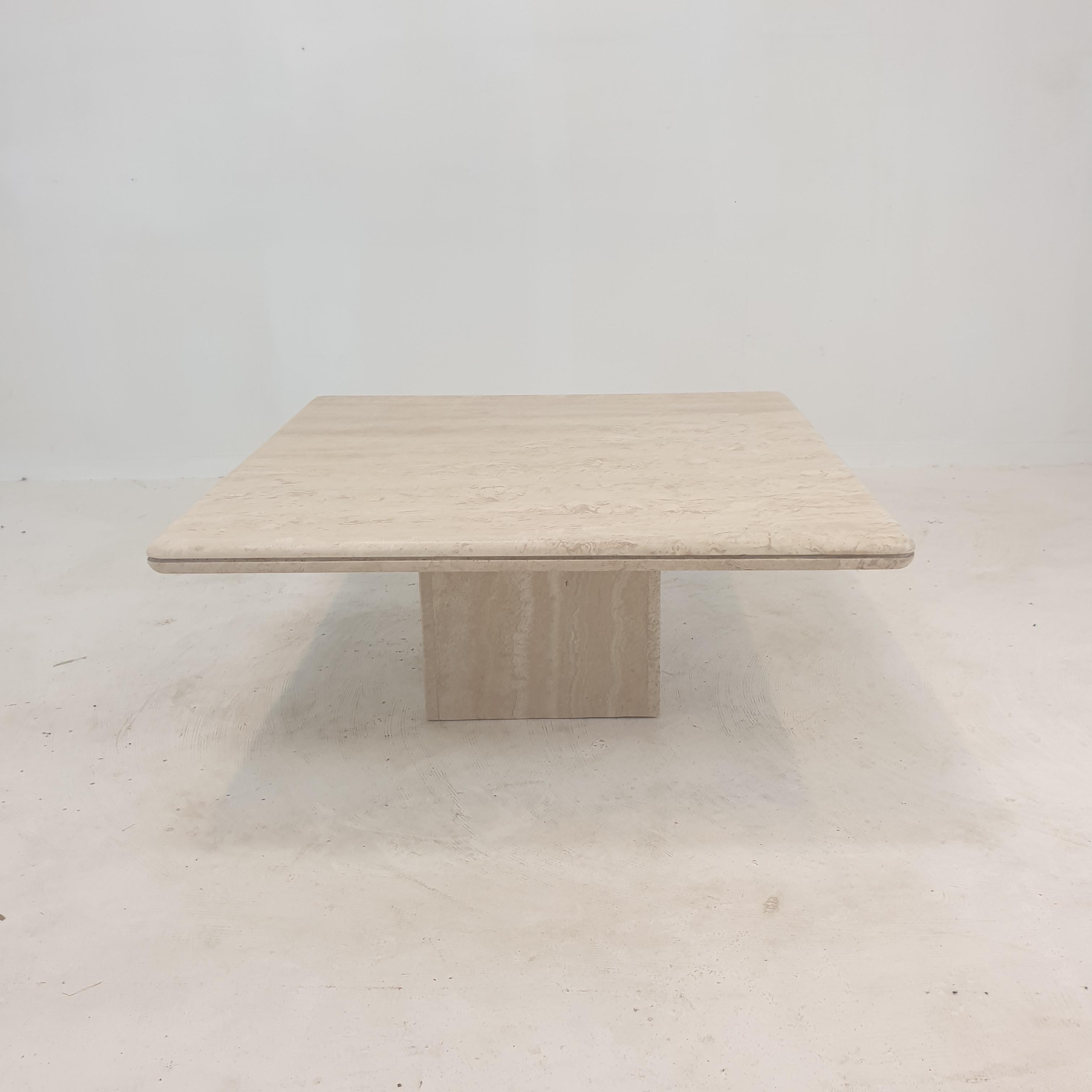 Very nice Italian coffee table handcrafted out of travertine, 1980's.

The beautiful square top is rounded on the edge. 
It is made of beautiful travertine.

It has the normal traces of use, see the pictures.

We work with professional