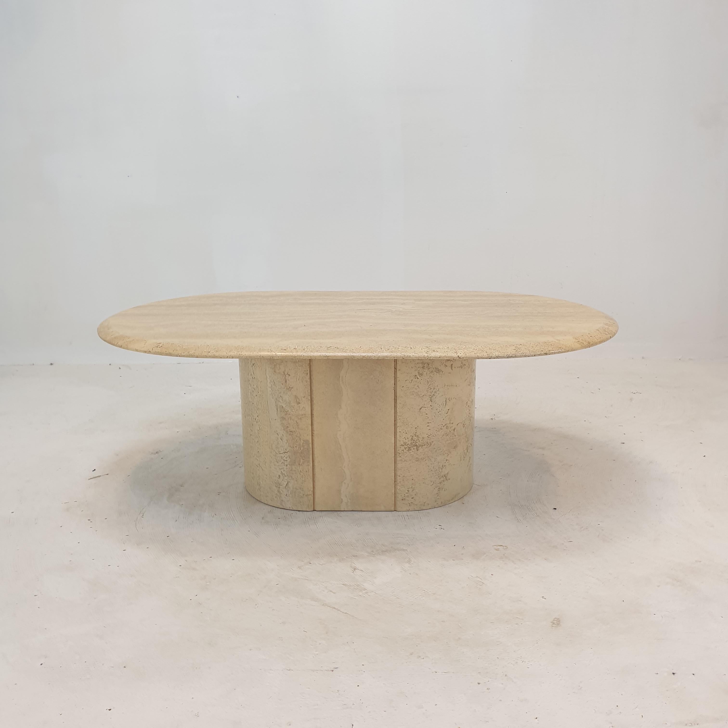 Stunning Italian coffee table handcrafted out of travertine, 1980's.

The beautiful oval top is rounded on the edge. 
It is made of beautiful travertine.

It has the normal traces of use, see the pictures.

We work with professional packers