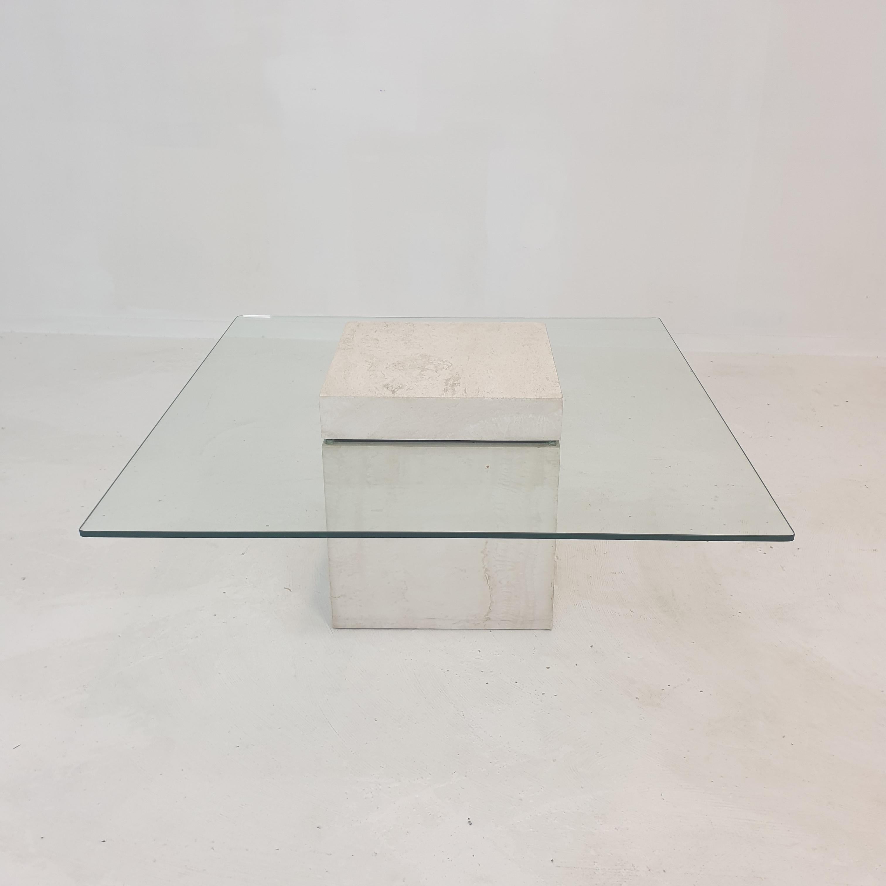Very nice Italian coffee table from the 1980s, handcrafted out of travertine. 

A glass plate and the base is made of very nice travertine.

We work with professional packers and shippers, we can deliver worldwide within 5 to 10 days.