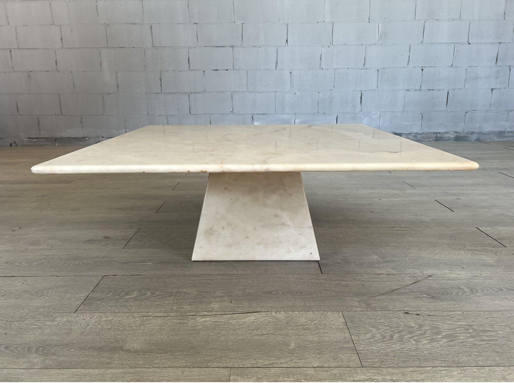Dimensions: H 16.4” x W 39” x D 39”

Mid-Century Modern Travertine stone coffee table with square top with beveled edge which rest on a travertine pyramid-shaped base in the style of Willy Rizzo. Classic design and clean lines.


Please see our