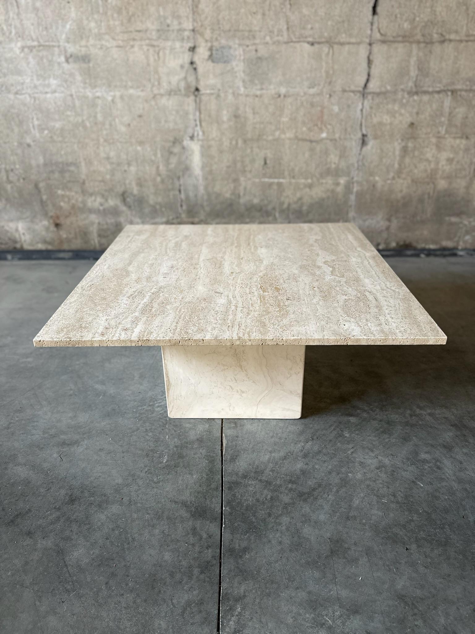 A beautiful, simple Italian coffee table made of travertine. Heavy duty and clean lines. A true mid-century prize!