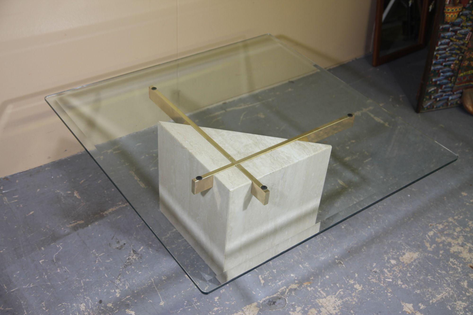 Late 20th Century Italian travertine coffee table with brass supports and glass top For Sale