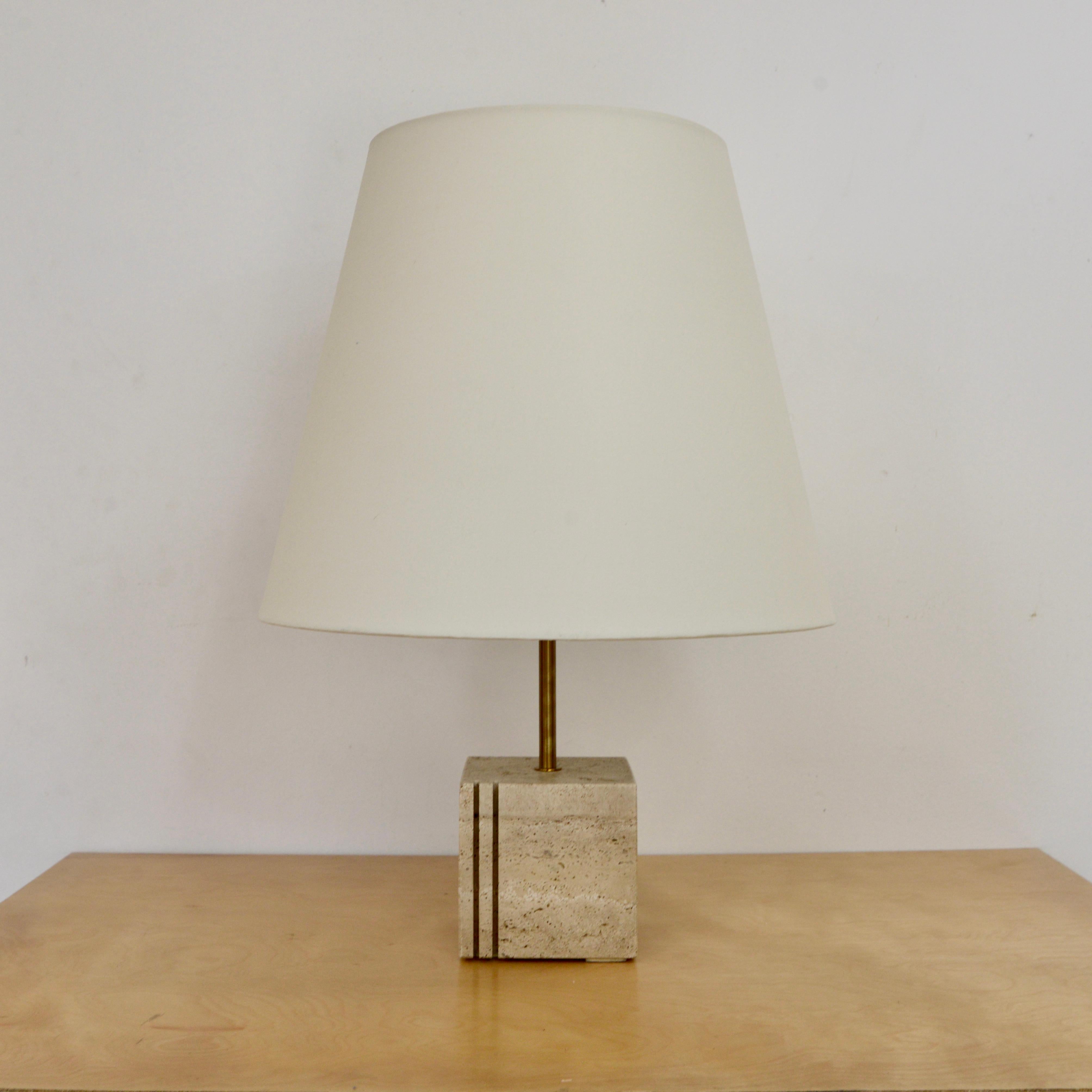 Vintage carved Italian cubic travertine table lamp from the 1950s. Restored and fully rewired with a single E26 medium based socket, ready to be used in the USA. 
Measurements:
Height: 22.5”
Shade diameter: 16”
Base diametre: 5” cubed.