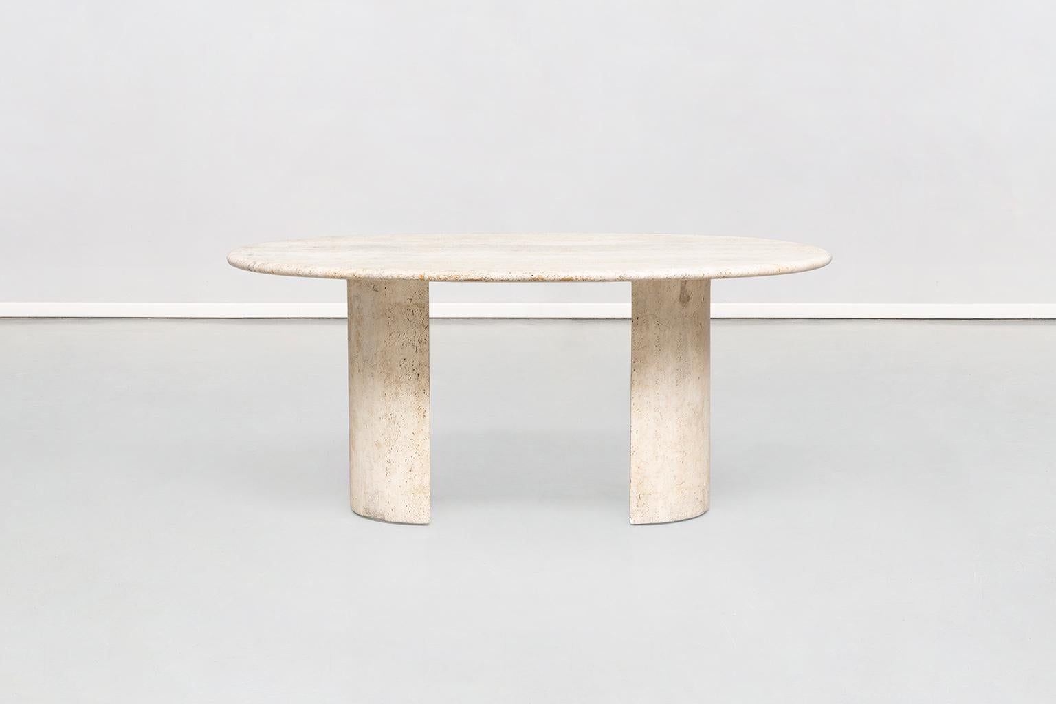 Italian mid-century modern Travertine Dining Table Dolmen by Cappellini, 1970s 
Sculptural dining table, Is composed of two twin blocks where a third and unique piece that is the top stays on, with all the three pieces in travertine marble.
This