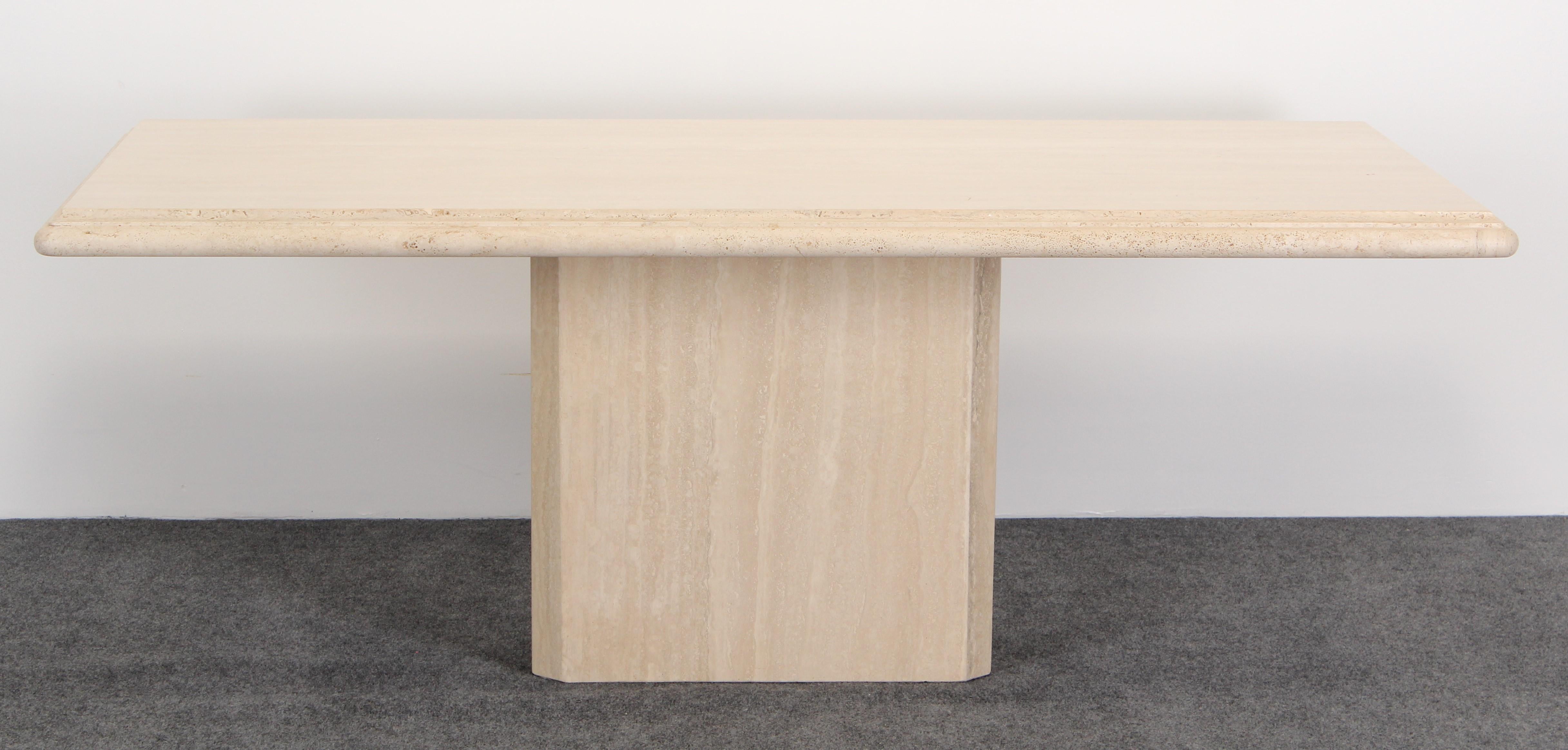 A stunning travertine marble dining table with beveled edges on a rectangular base. This set is in two pieces for easy assemblage. Very good condition.