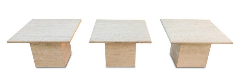 An amazing set of filled and polished tops, travertine-marble tables, with natural and porous travertine bases. The simplicity of the design and surface treatments is what makes this set a classic example of strong and stoic Italian Minimalist